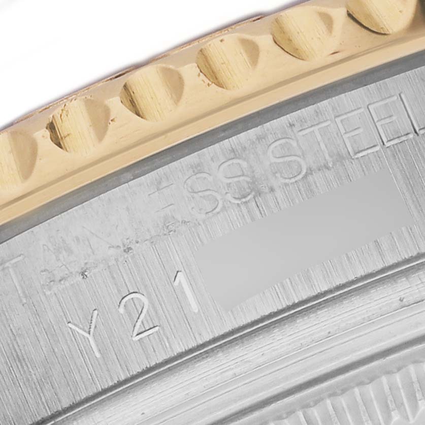 The image shows a close-up of the engraved inner bezel and the edge of the outer bezel of a Rolex Yacht-Master 168623 Men's Steel and Gold (two tone) Mother of Pearl Dial 168623 Men's Steel and Gold (two tone) Mother of Pearl Dial watch.