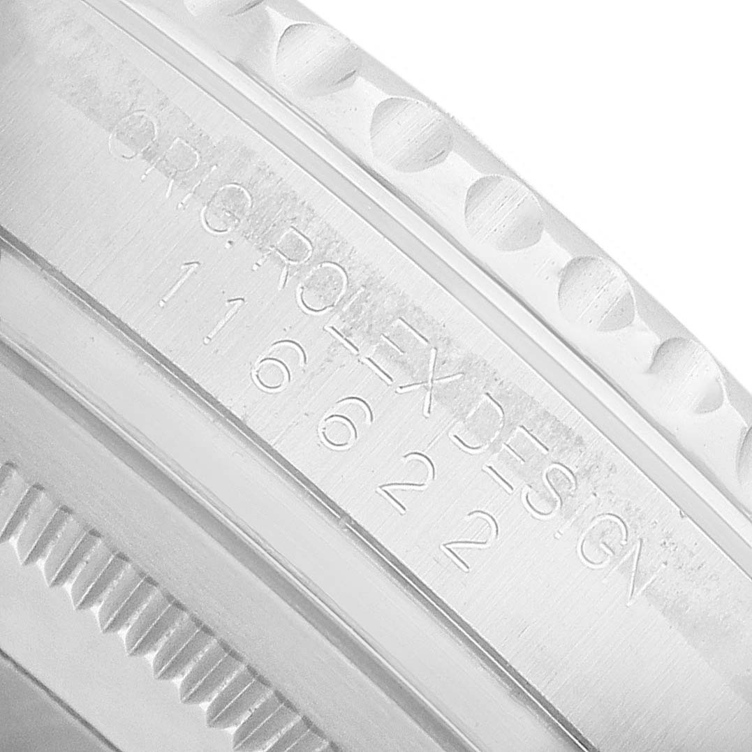 The image shows an angled close-up of the Rolex Yacht-Master 116622 Men's Stainless Steel Silver Dial's engraved bezel edge and case side.