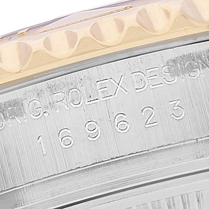 Close-up of the side of a Rolex Yacht-Master 169623 Women's Steel and Gold (two tone) White Dial 169623 Women's Steel and Gold (two tone) White Dial showing the model number and bezel details.