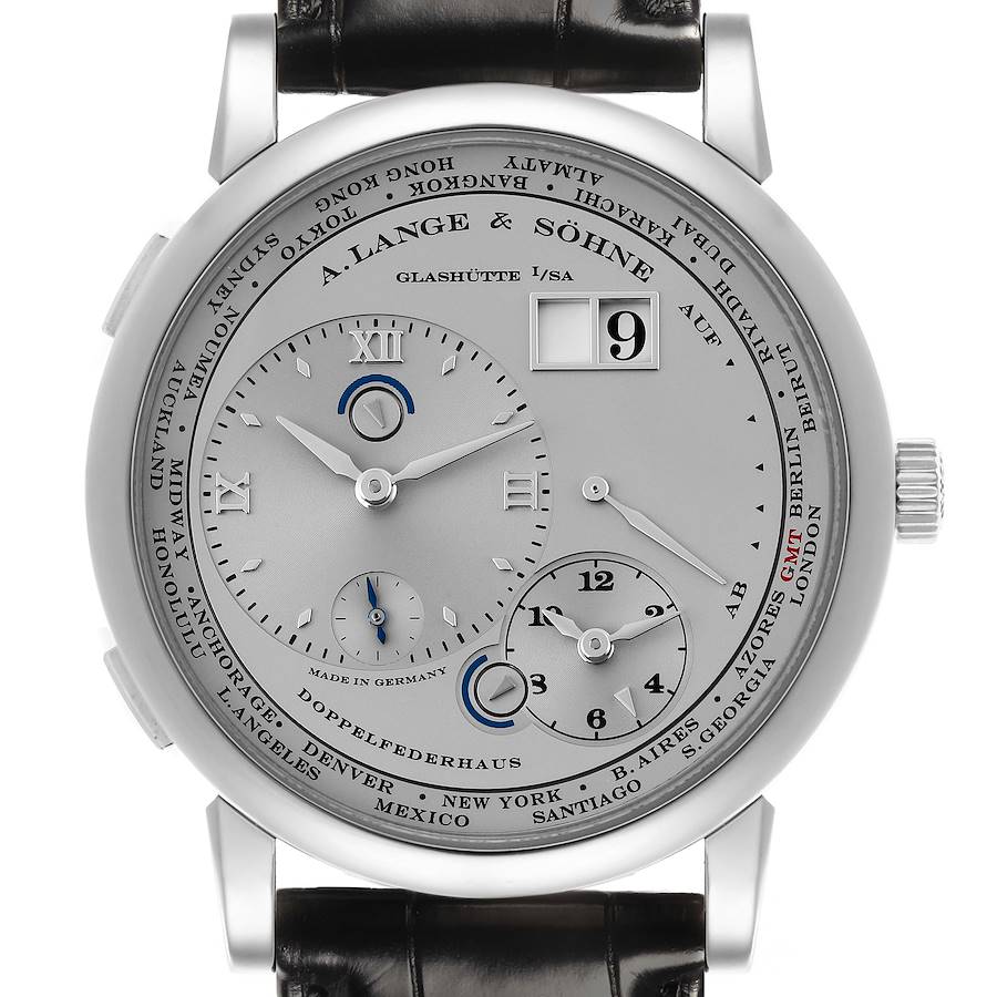 The A. Lange & Söhne Lange 1 watch is shown from the front, displaying its dial, time zones, and date indicators.