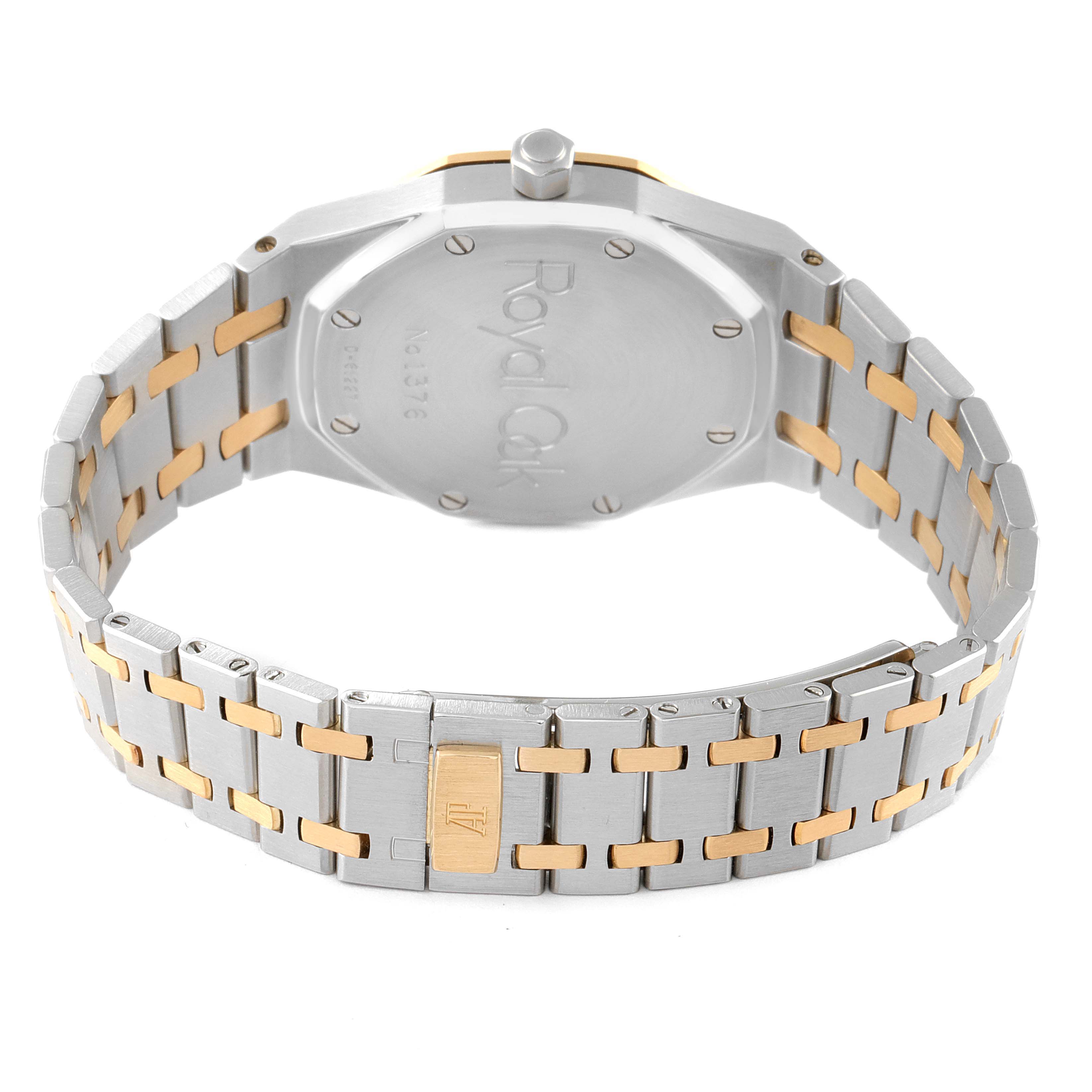 The image shows the case back and bracelet of an Audemars Piguet Royal Oak 14790SA.OO.0789SA.01 Men's Steel and Gold (two tone) Grey Dial 14790SA.OO.0789SA.01 Men's Steel and Gold (two tone) Grey Dial watch, highlighting the two-tone metal finish.