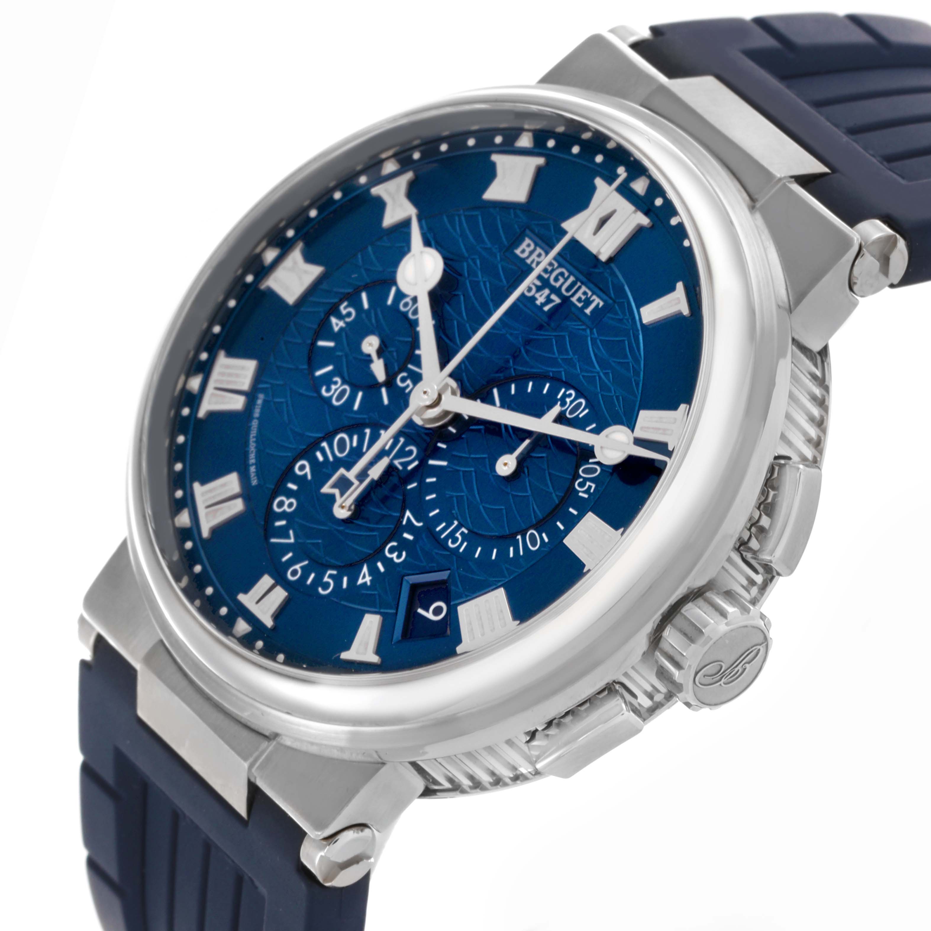 This Breguet Marine 5527BB/Y2/9WV Men's White Gold Blue Dial 5527BB/Y2/9WV Men's White Gold Blue Dial watch is shown at an angle highlighting the face, bezel, crown, and rubber strap.