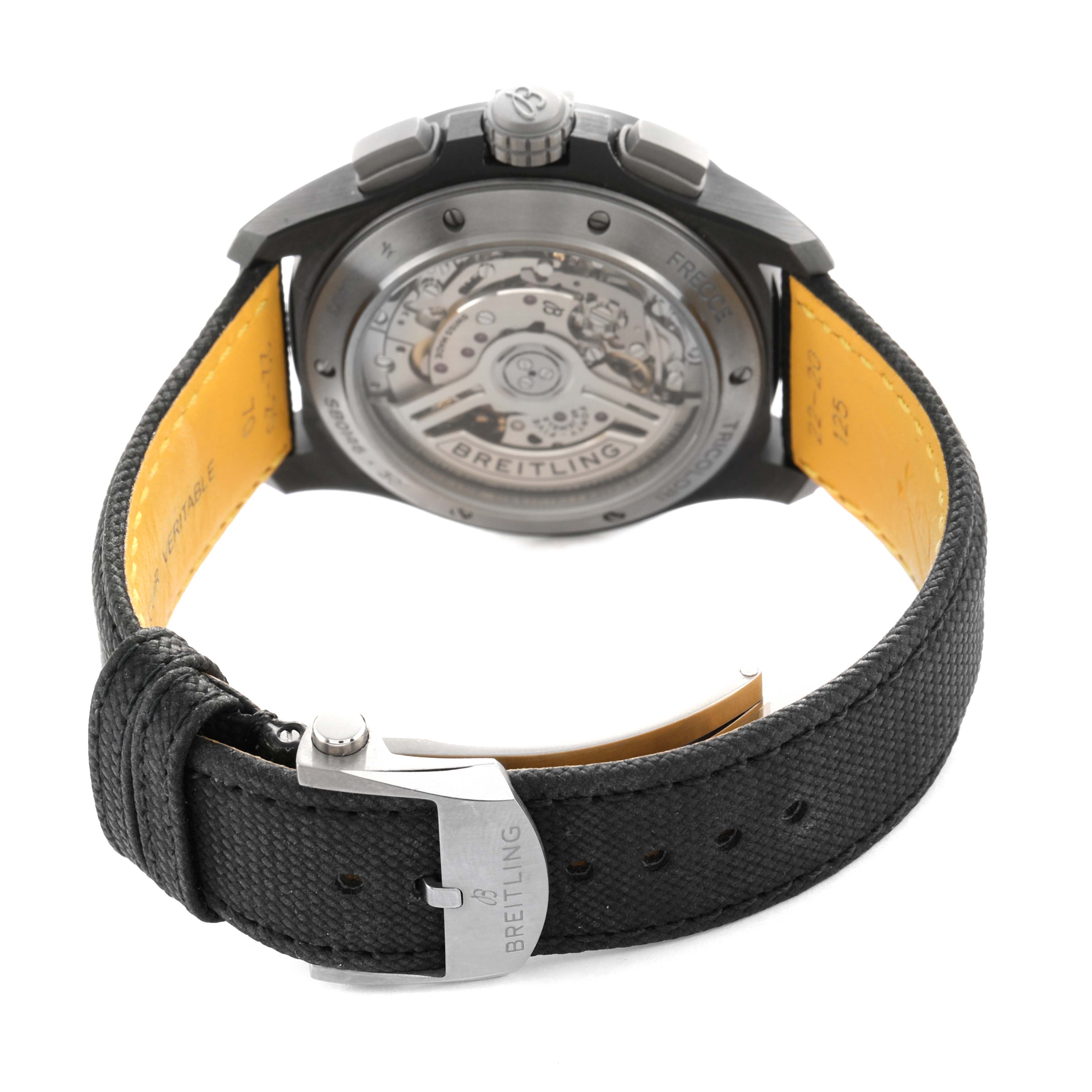 The image shows the back of a Breitling Avenger SB0146 Men's Ceramic Green Dial watch, featuring its transparent case back and textured strap with a clasp.