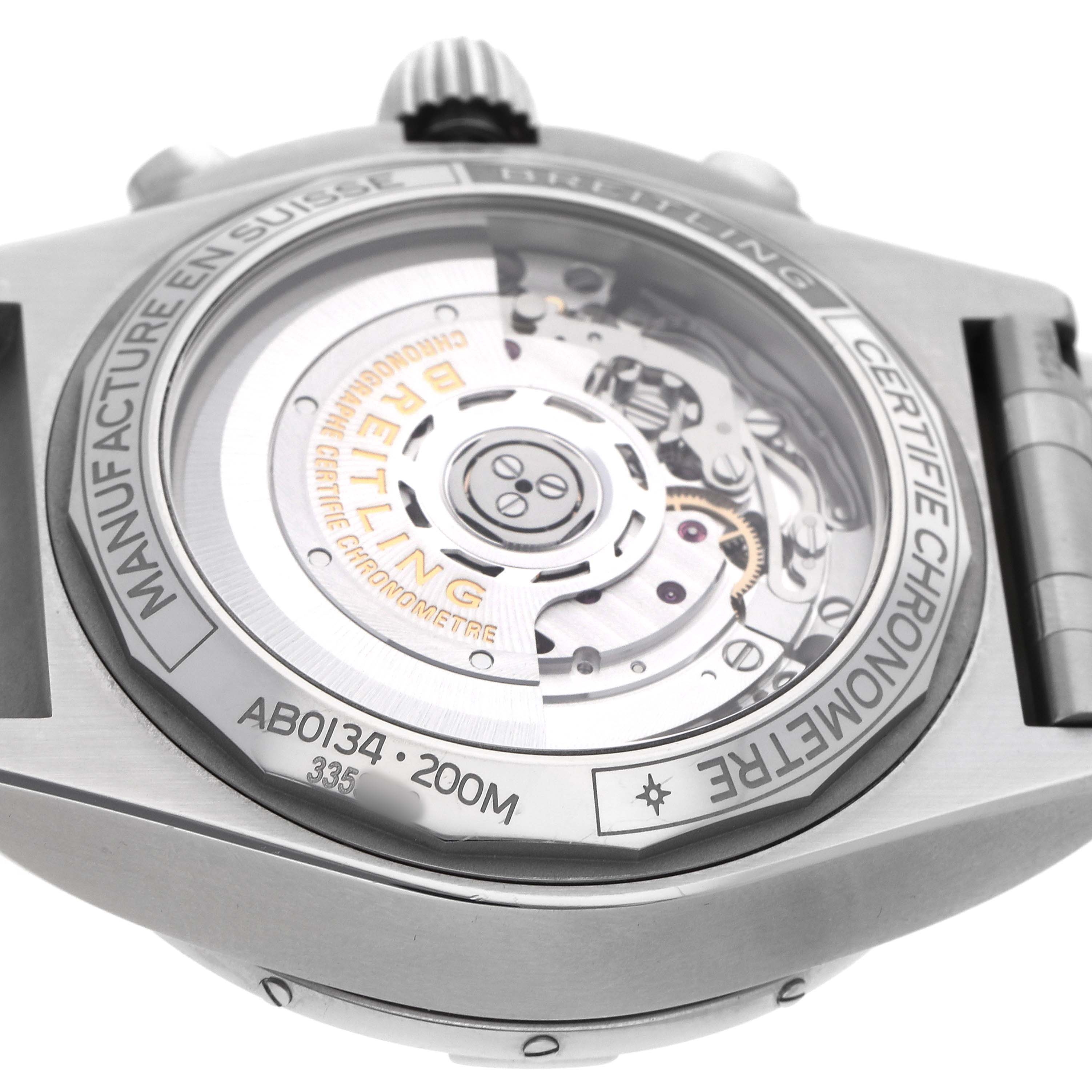 The image shows the back of the Breitling Chronomat AB0134 Men's Stainless Steel Silver Dial watch, highlighting the movement through a transparent case back.