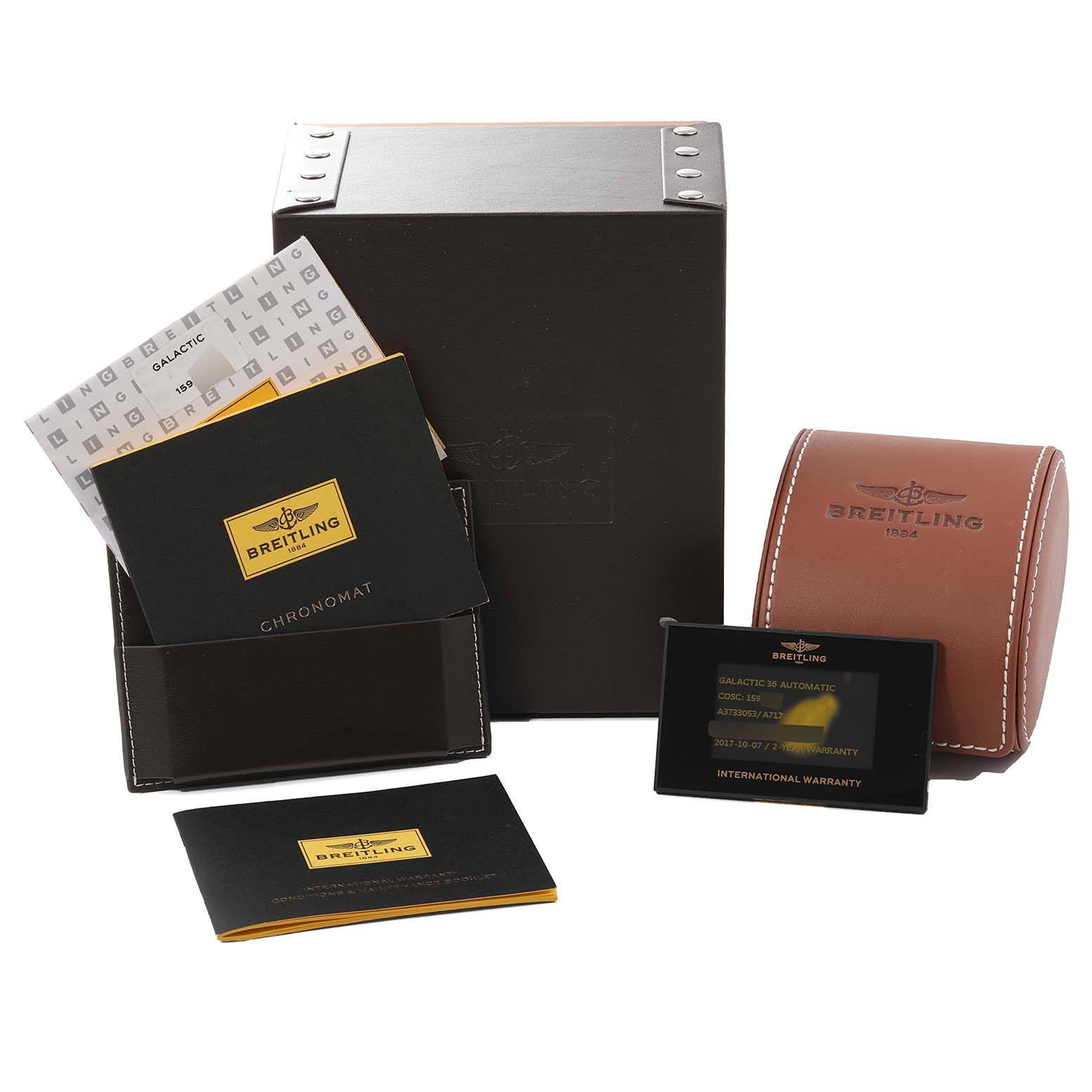 This angle shows the box, card, leather case, and documents for the Breitling A3733053/A717 Women's Stainless Steel Mother of Pearl Dial A3733053/A717 Women's Stainless Steel Mother of Pearl Dial Galactic 36 Mother Of Pearl Dial Diamond Steel Ladies Watch A37330.