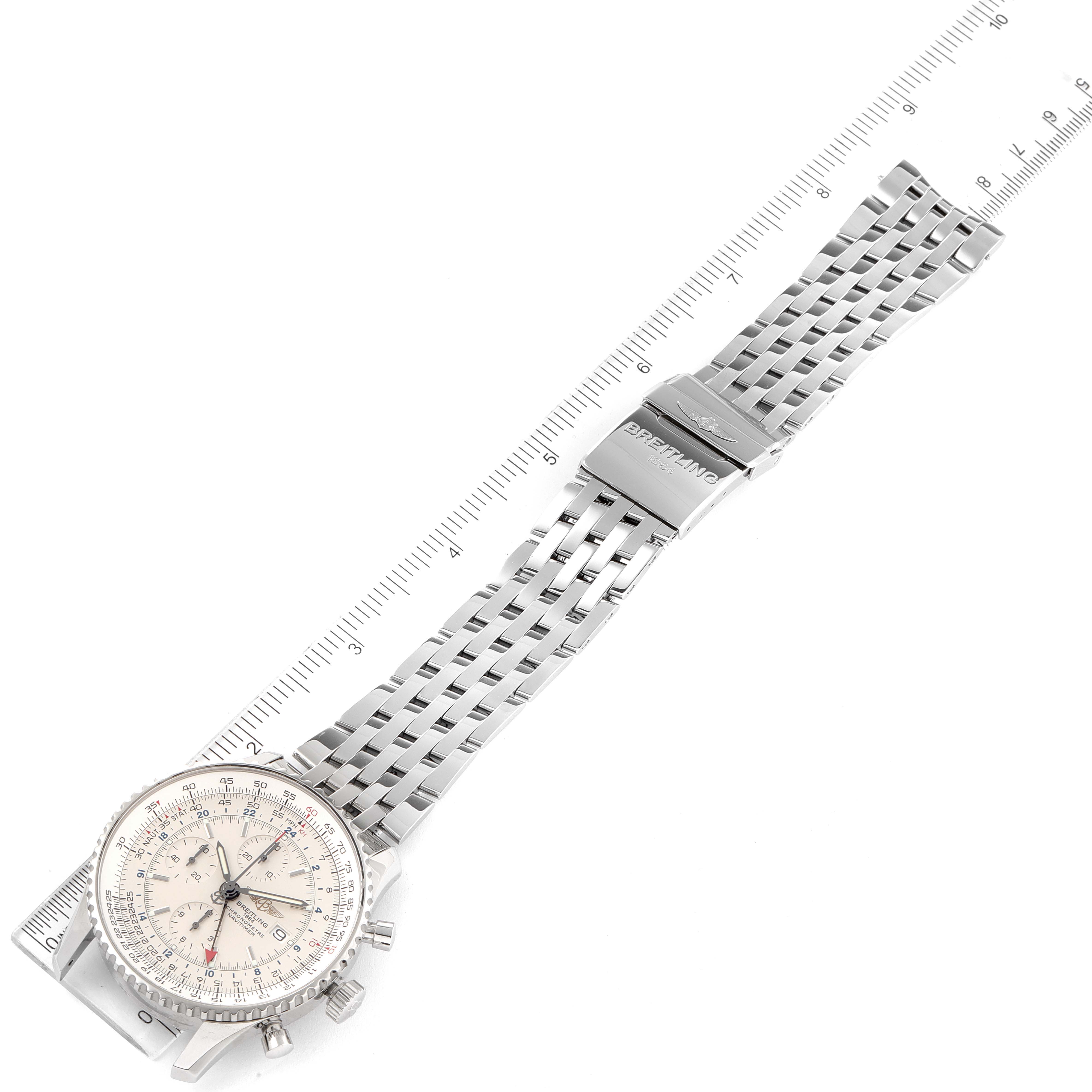 The image shows a top-down view of a Breitling Navitimer A24322 Men
s Stainless Steel Silver Dial A24322 Men
s Stainless Steel Silver Dial watch with its metal bracelet fully extended and a ruler for scale.