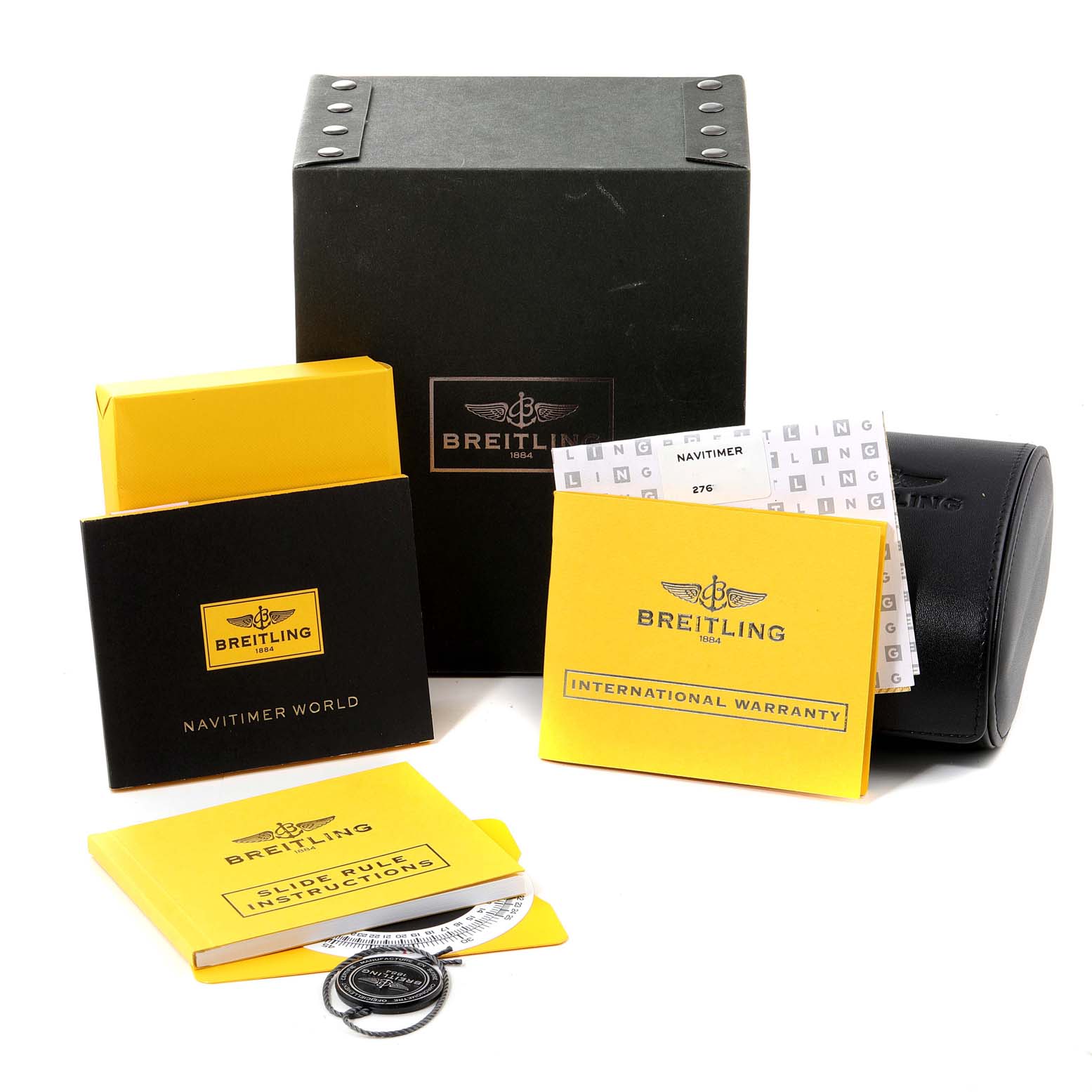 The image displays the packaging, manuals, and accessories for a Breitling Navitimer A24322 Men
s Stainless Steel Silver Dial A24322 Men
s Stainless Steel Silver Dial watch.