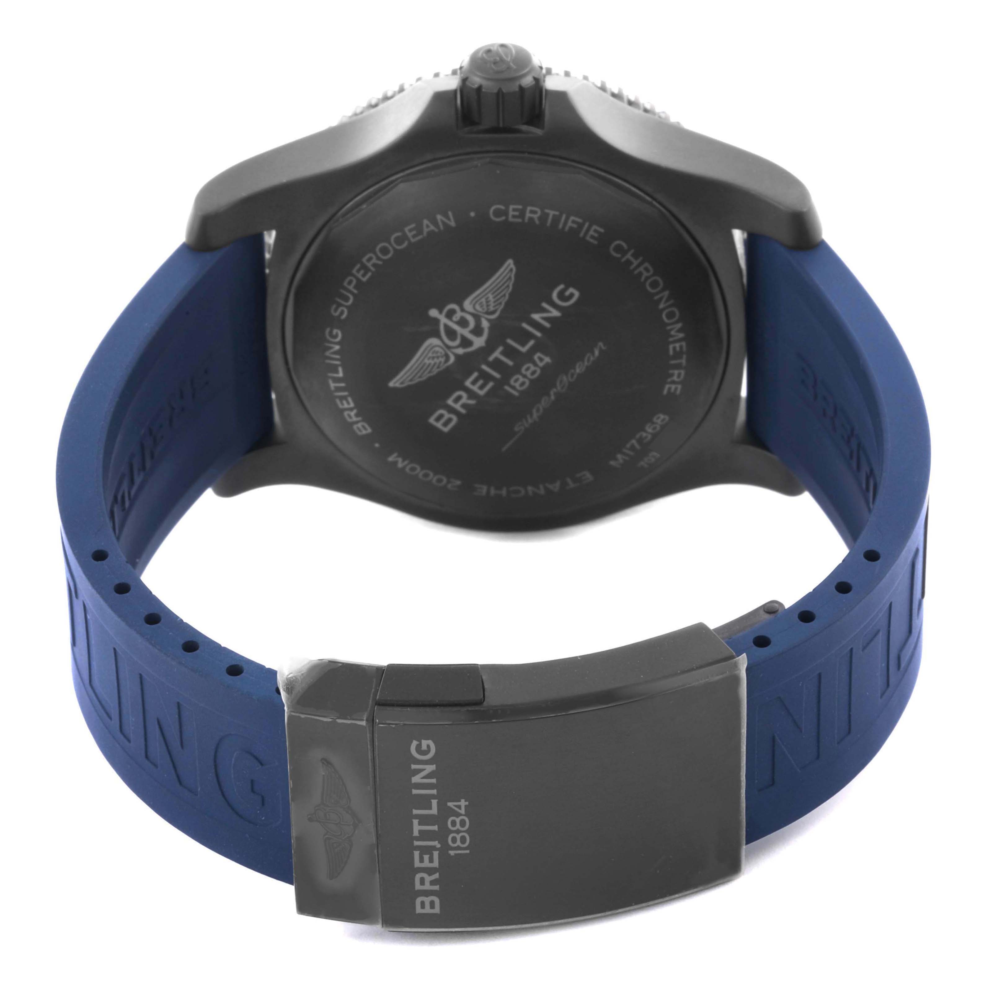 The image shows the back of a Breitling Superocean M17368 Men's Stainless Steel Blue Dial watch, featuring its case back, crown, and blue strap.