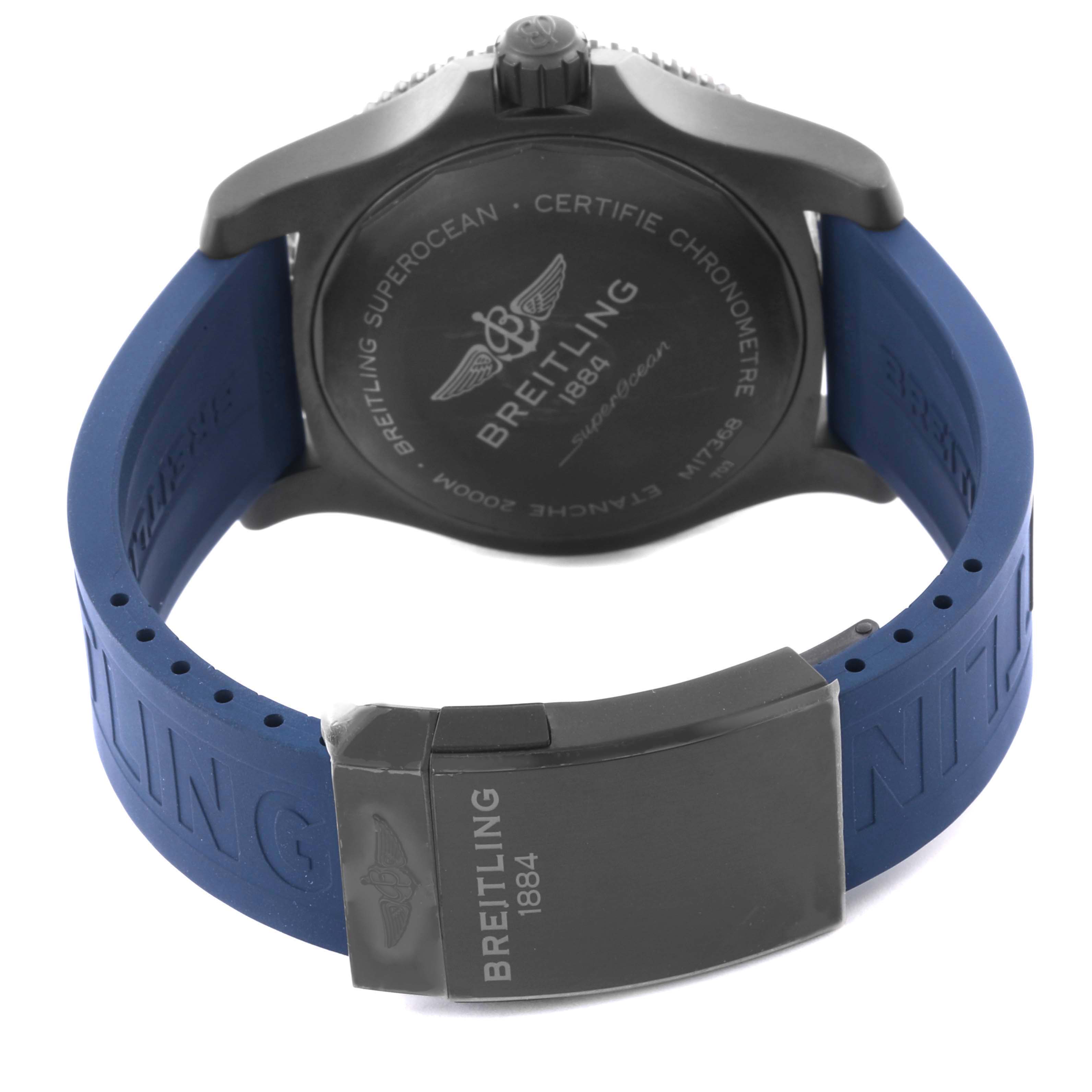 The image shows the back of the Breitling Superocean M17368 Men
s Stainless Steel Blue Dial M17368 Men
s Stainless Steel Blue Dial watch and its blue strap from a rear angle.