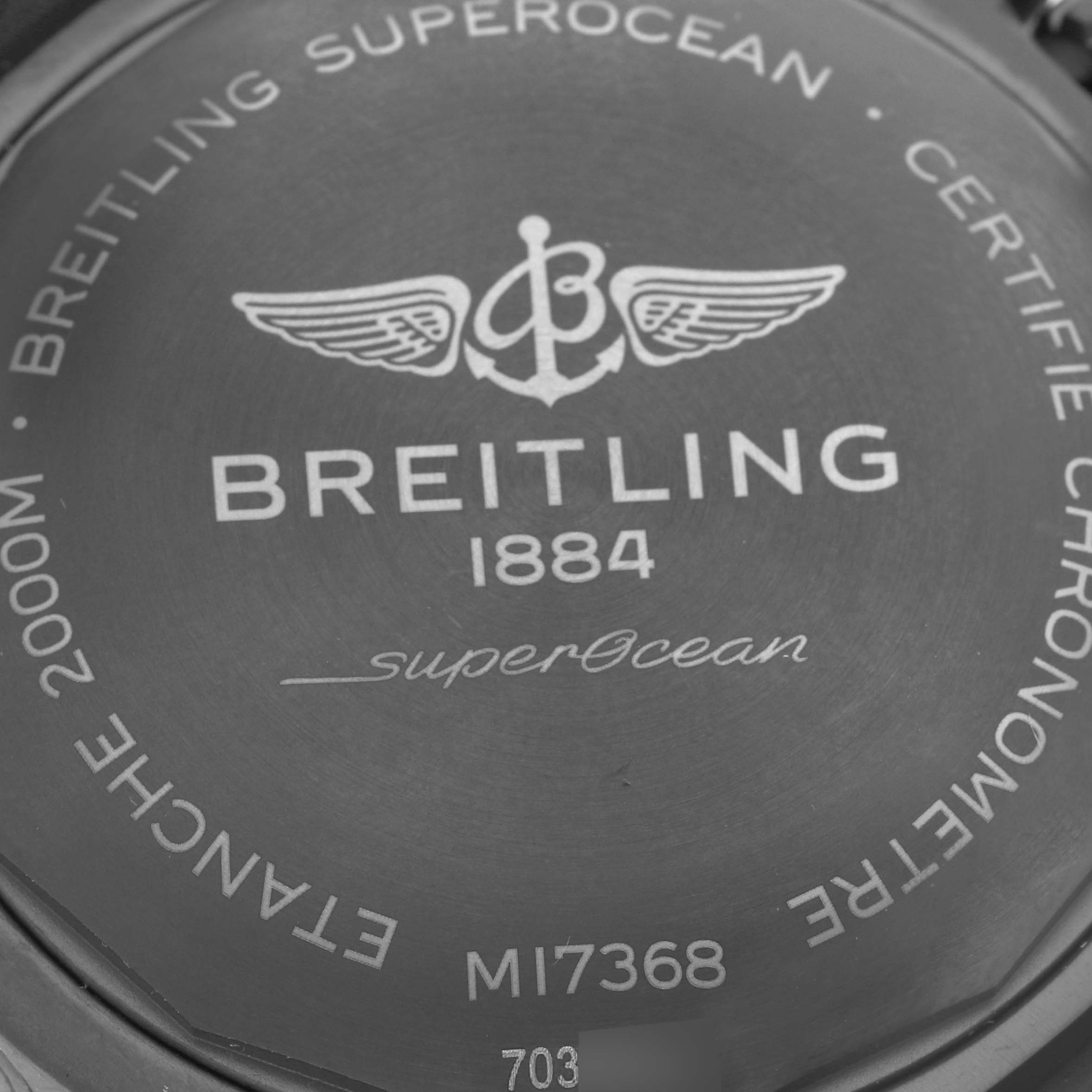 The image shows the back case of the Breitling Superocean M17368 Men
s Stainless Steel Blue Dial M17368 Men
s Stainless Steel Blue Dial watch, highlighting its branding and model details.