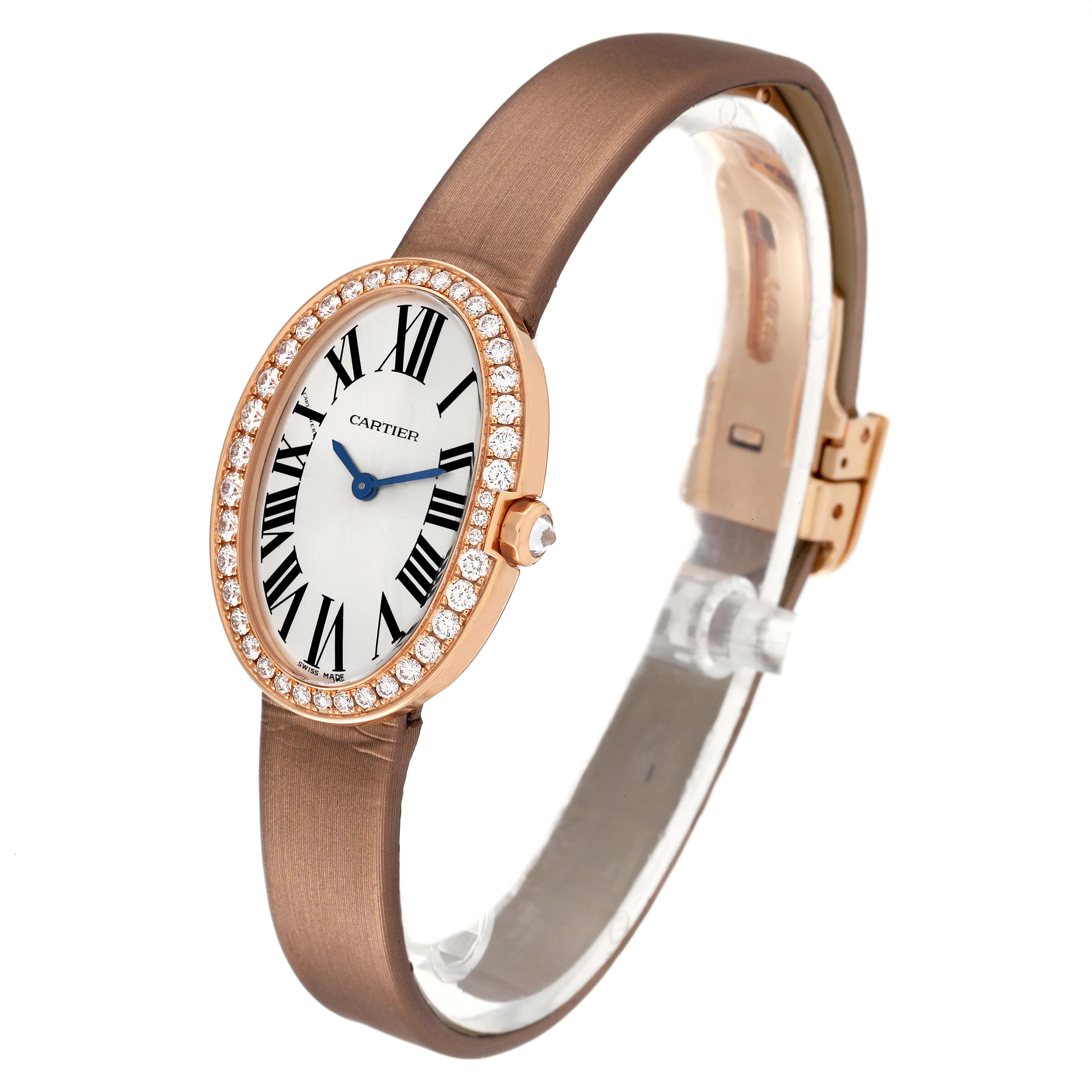 The Cartier Baignoire WB520004 Women's Rose Gold Silver Dial WB520004 Women's Rose Gold Silver Dial model watch is shown at a slight angle, displaying its oval face, diamond bezel, and leather strap.