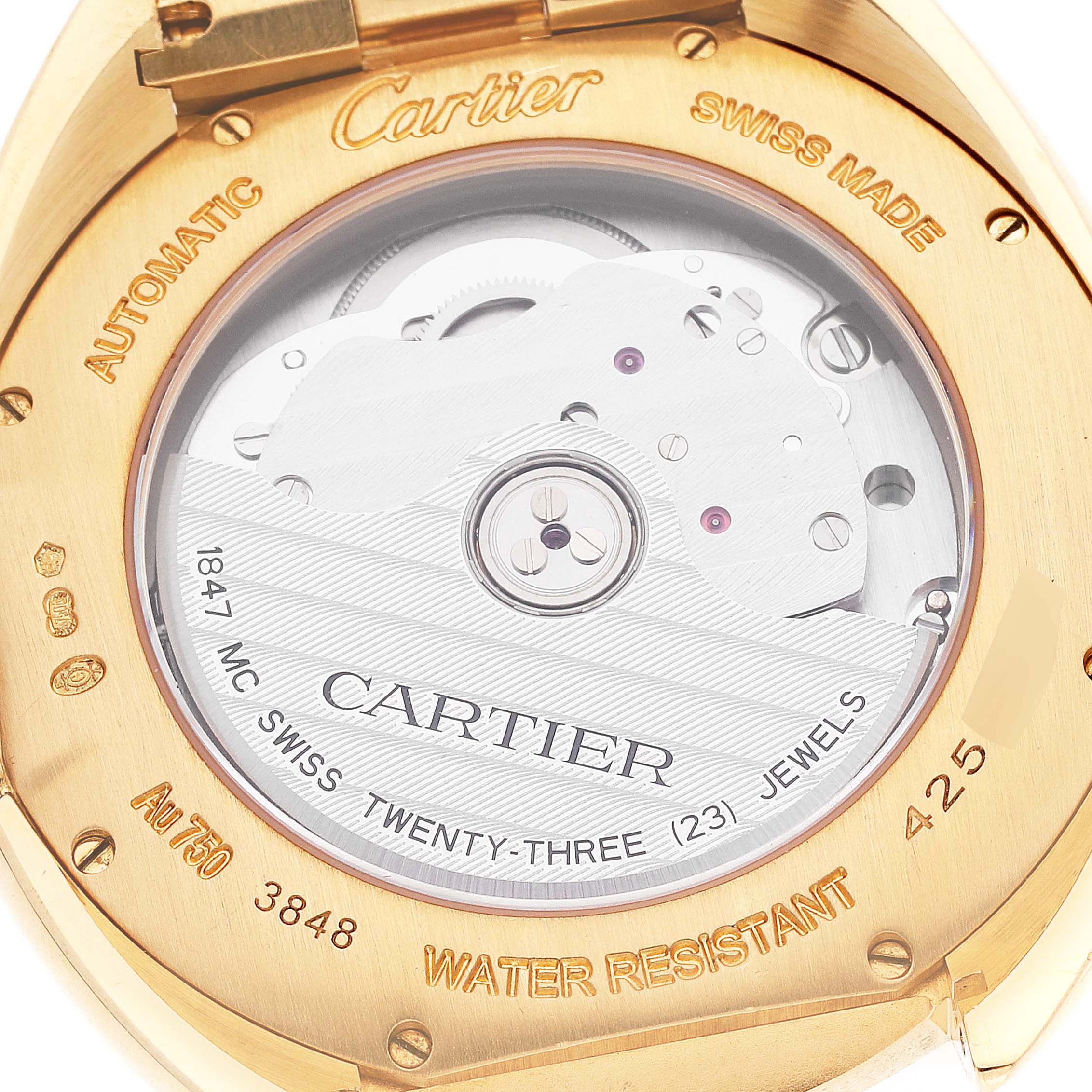 The image shows the back view of the Cartier Clé watch, displaying its automatic movement and markings.