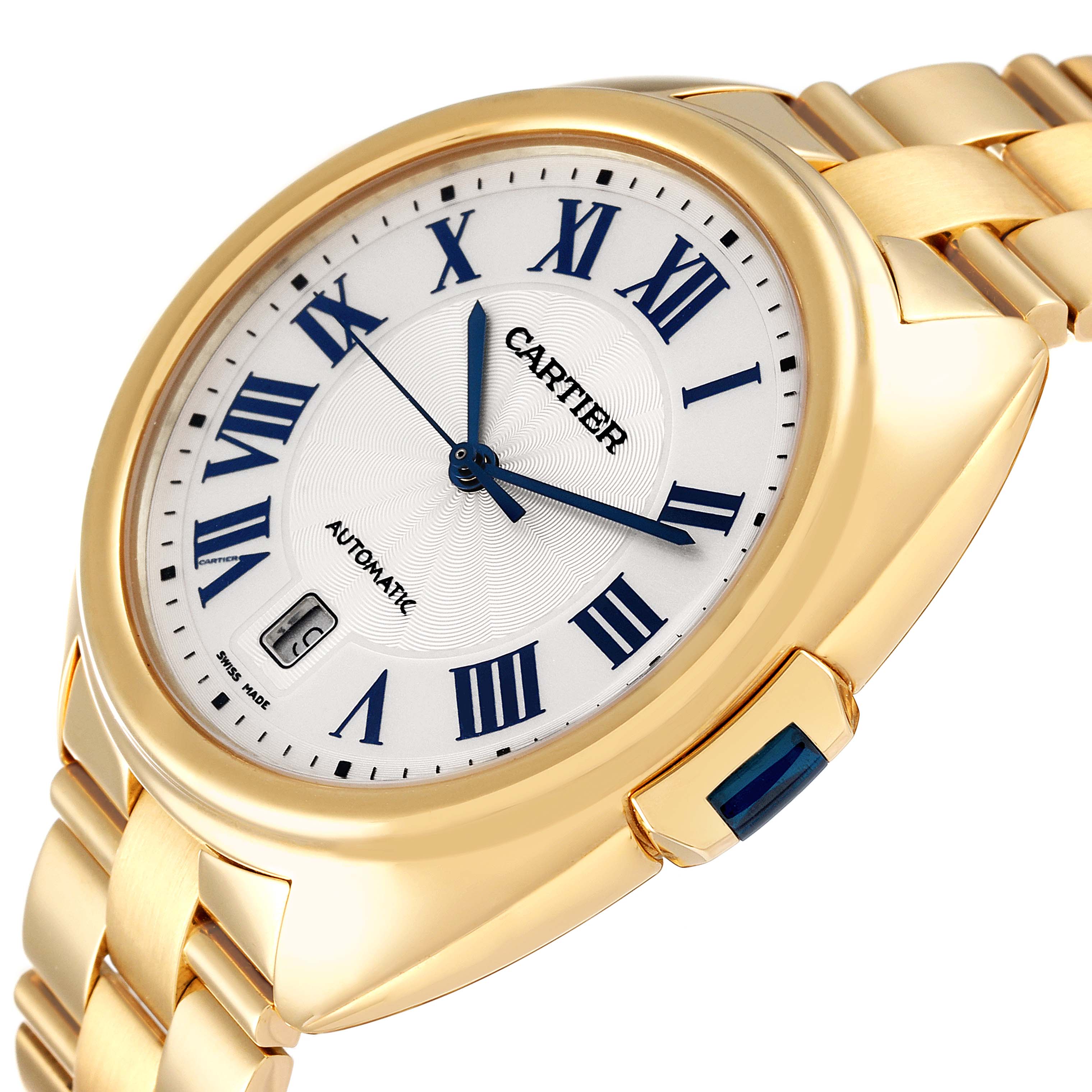 The Cle de Cartier watch is shown at a slight angle, highlighting its white dial, blue Roman numerals, and gold bracelet.