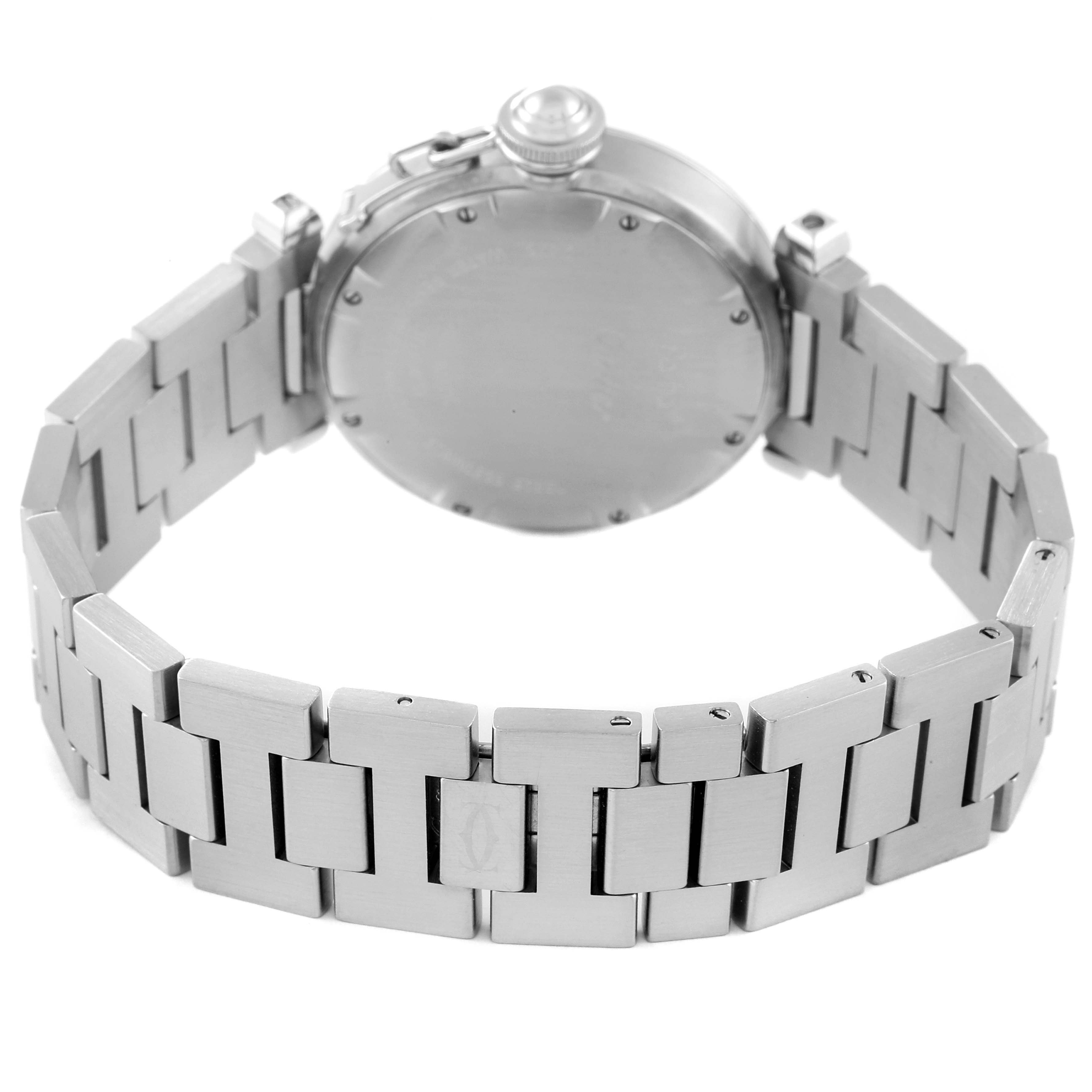 The image shows the back of a Cartier Pasha W31055M7 Women's Stainless Steel White Dial W31055M7 Women's Stainless Steel White Dial watch, highlighting its stainless steel bracelet and case back.