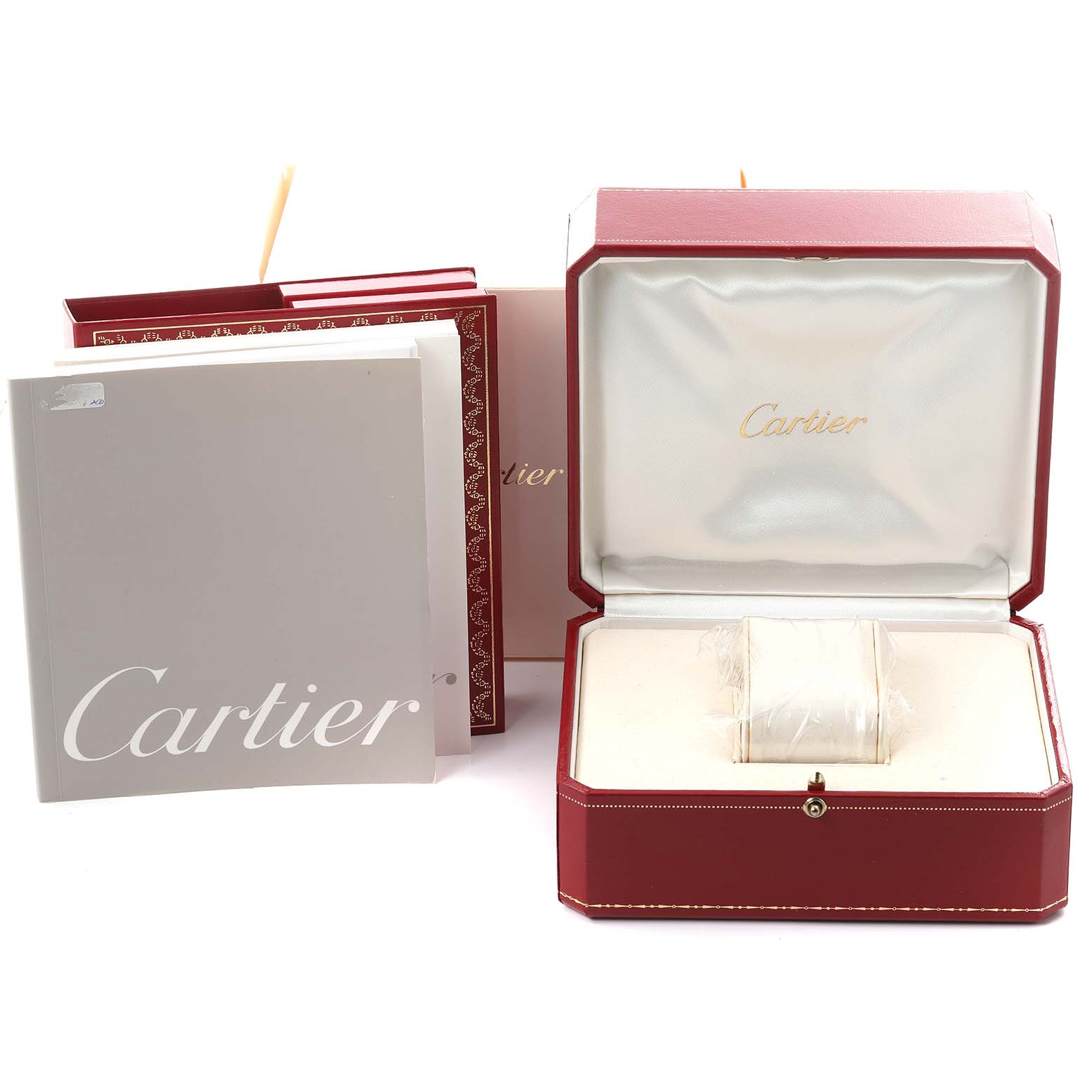 The image shows a Cartier Pasha W31044M7 Men's Stainless Steel White Dial W31044M7 Men's Stainless Steel White Dial watch box and packaging, including manuals and an empty watch cushion.