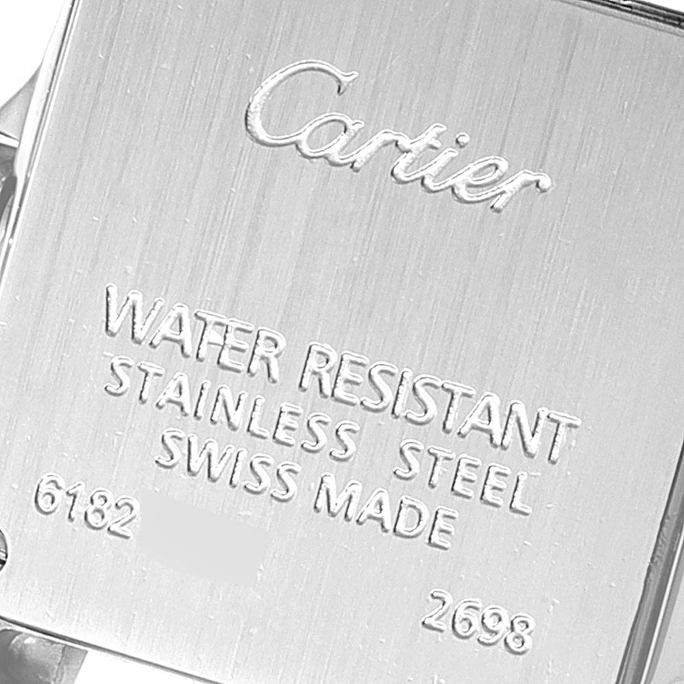 The image shows the back case of the Santos Demoiselle model by Cartier, highlighting branding and specifications.
