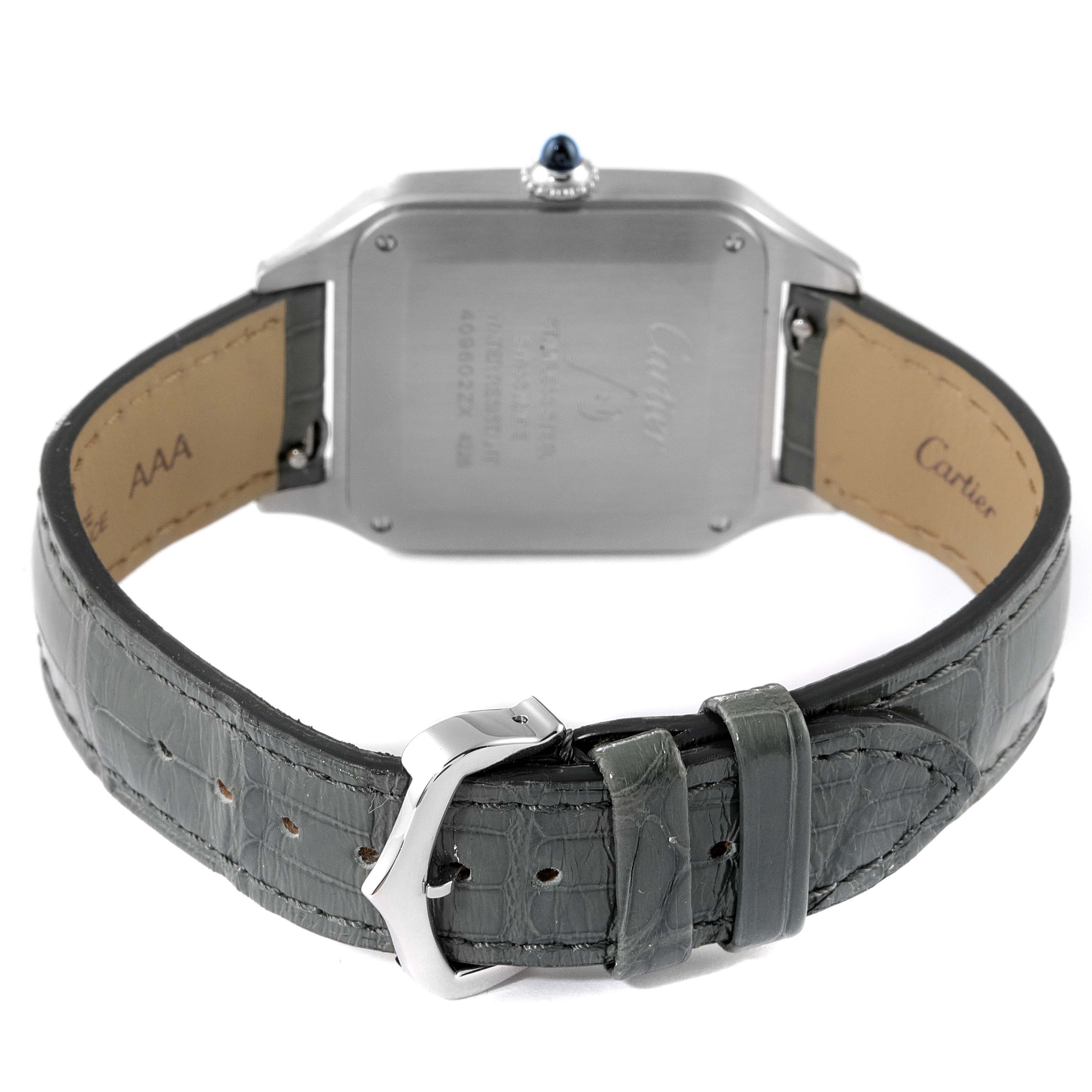 The image shows the back view of a Cartier Santos Dumont WSSA0022 Men's Stainless Steel Silver Dial WSSA0022 Men's Stainless Steel Silver Dial watch, including the case back, crown, and leather strap with buckle.