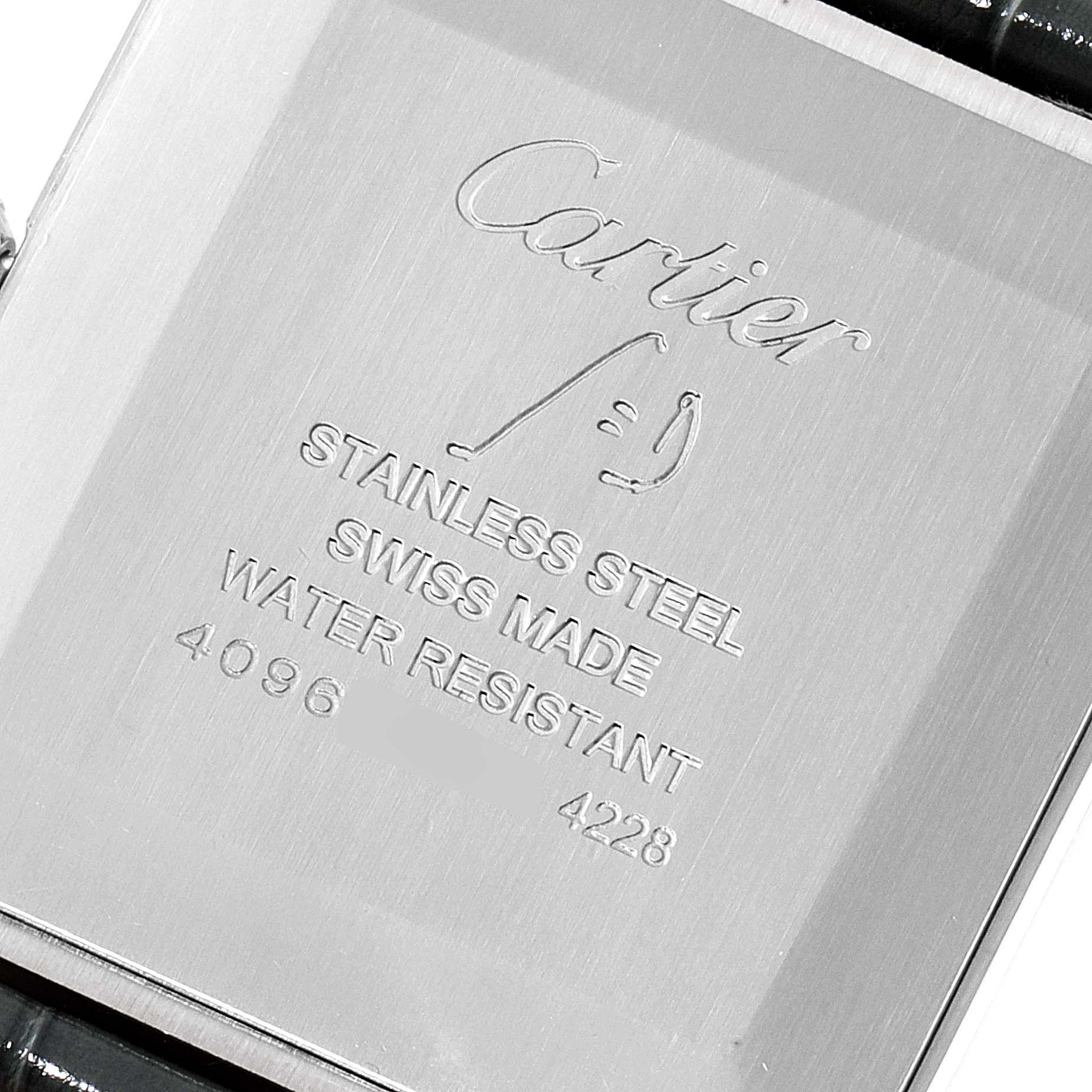This image shows the back case of the Cartier Santos Dumont WSSA0022 Men's Stainless Steel Silver Dial WSSA0022 Men's Stainless Steel Silver Dial watch, displaying engravings and material details.