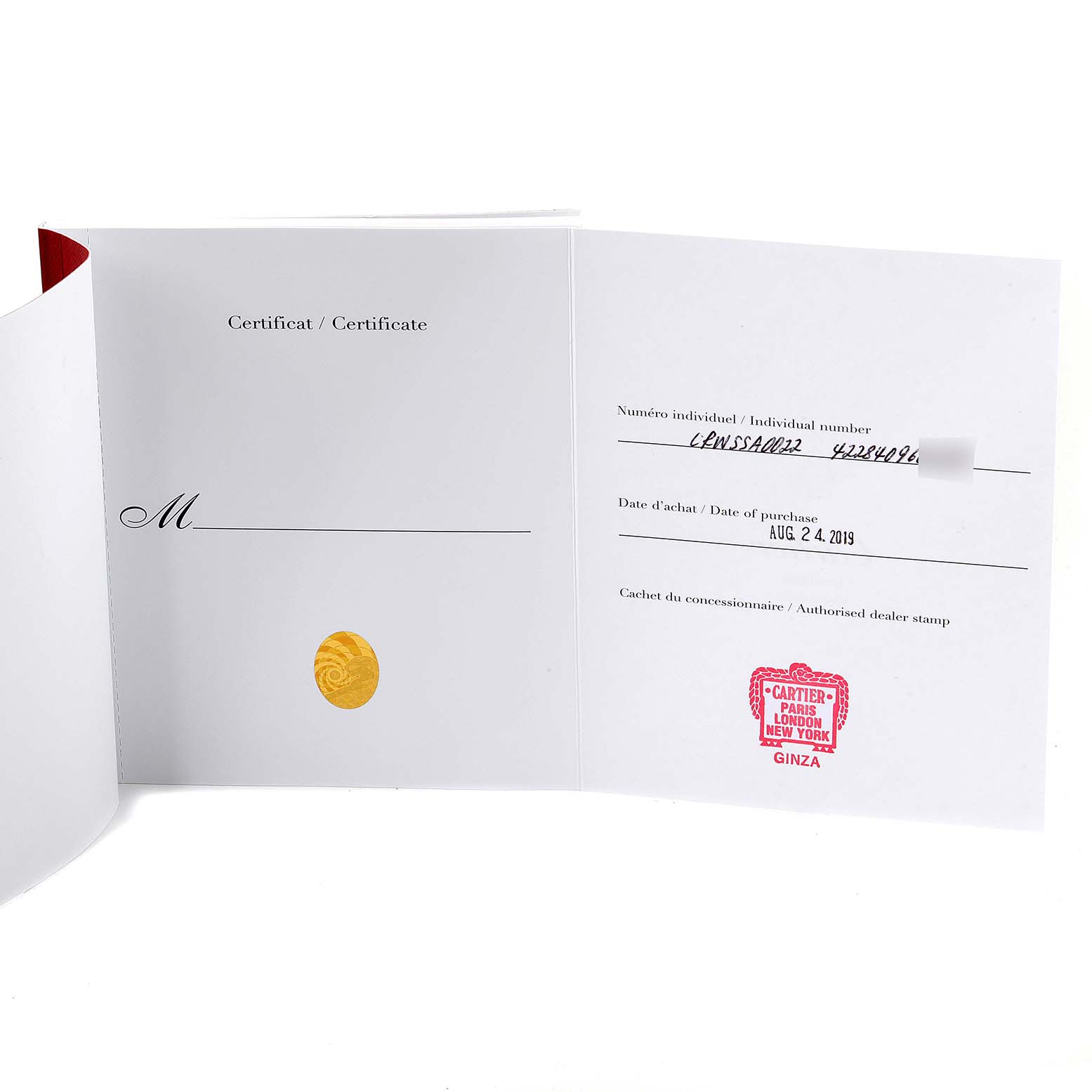 The image shows an opened certificate booklet for the Cartier Santos Dumont WSSA0022 Men's Stainless Steel Silver Dial WSSA0022 Men's Stainless Steel Silver Dial watch, displaying purchase details and a dealer stamp.