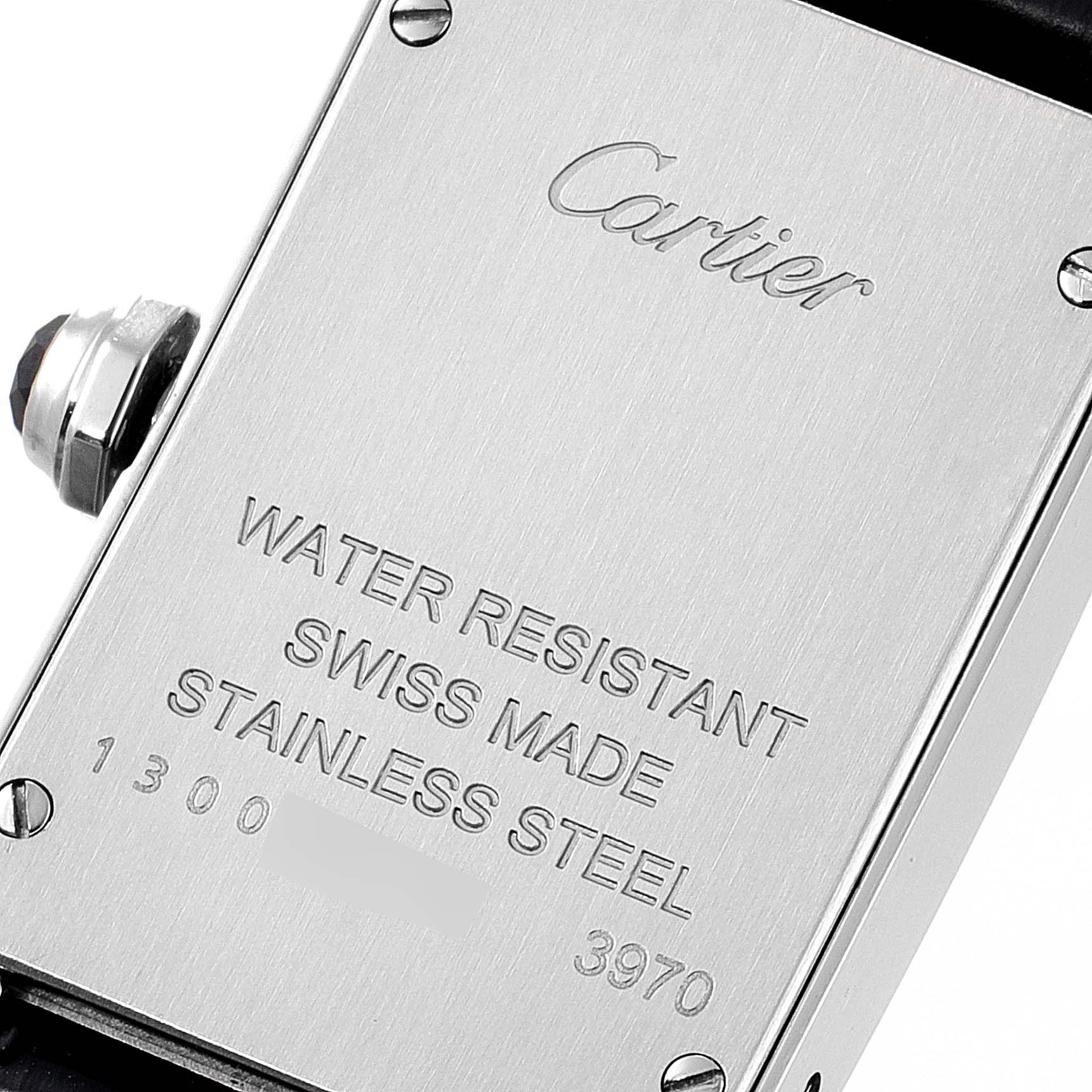 The image shows the back case and side crown of a Cartier Tank Americaine WSTA0016 Women's Stainless Steel Silver Dial WSTA0016 Women's Stainless Steel Silver Dial watch.