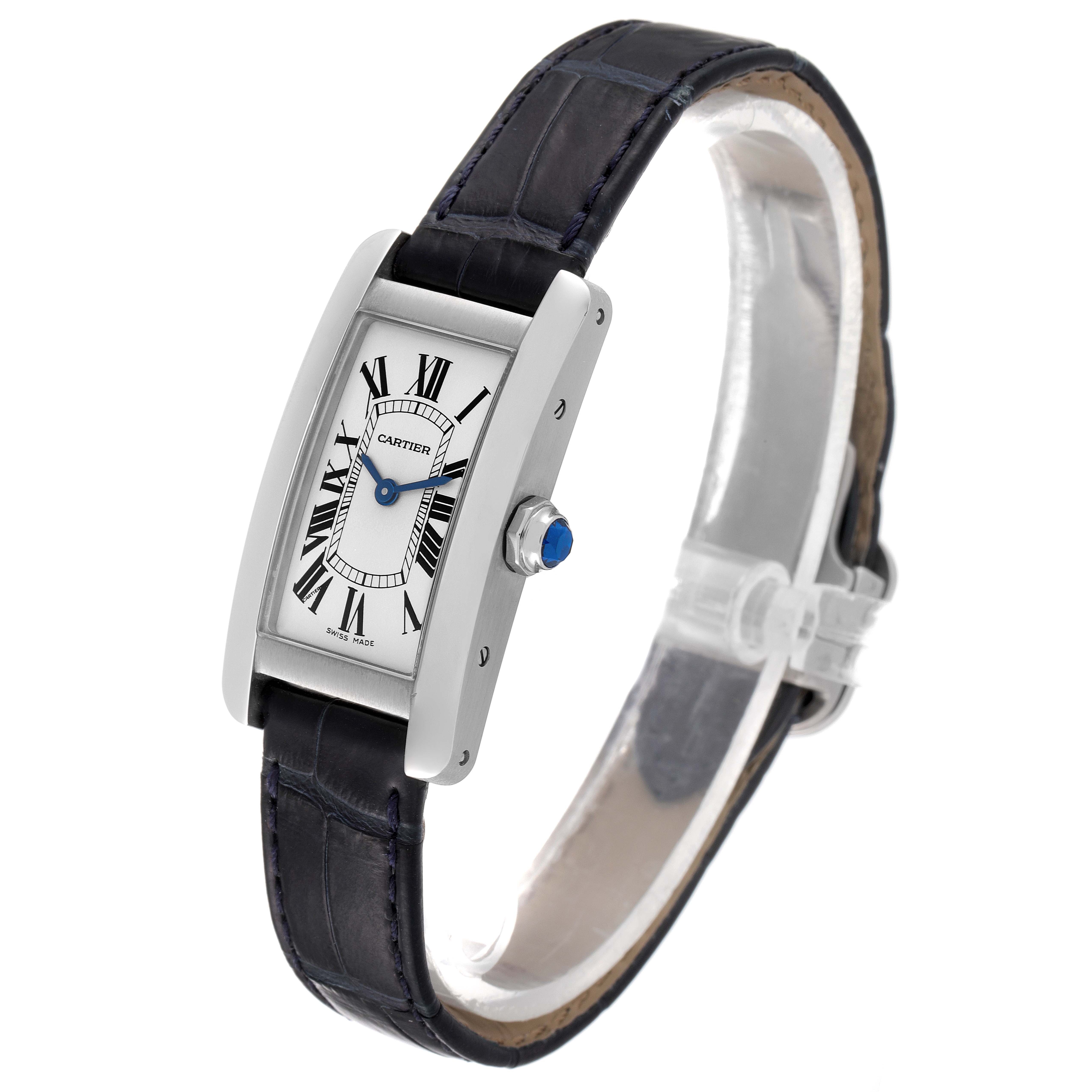 The image shows a Cartier Tank Americaine WSTA0016 Women's Stainless Steel Silver Dial WSTA0016 Women's Stainless Steel Silver Dial watch at a slight side angle, highlighting the face, black leather strap, and crown with a blue cabochon.