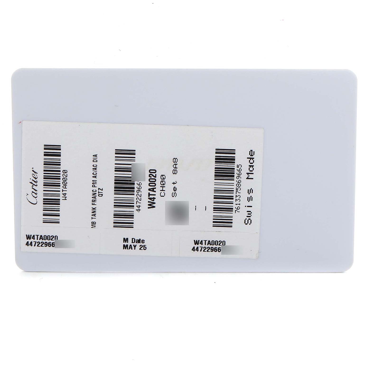 It's a label for the Cartier Tank Francaise W4TA0020 Women's Stainless Steel Silver Dial model, showing serial numbers and Swiss Made marking.