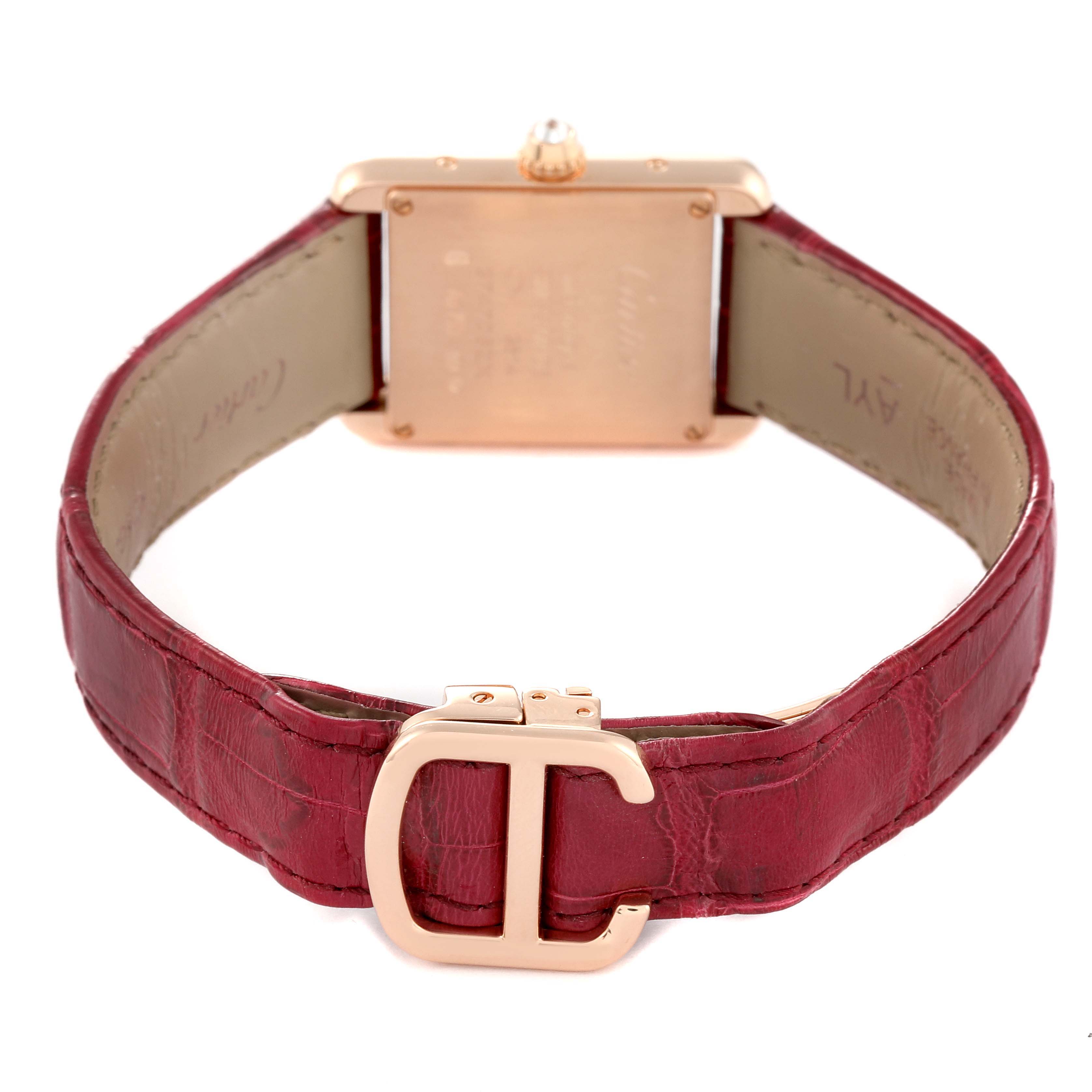 This image shows the back of the Cartier Tank Louis WJTA0010 Women's Rose Gold Silver Dial WJTA0010 Women's Rose Gold Silver Dial watch with a red leather strap and gold buckle.