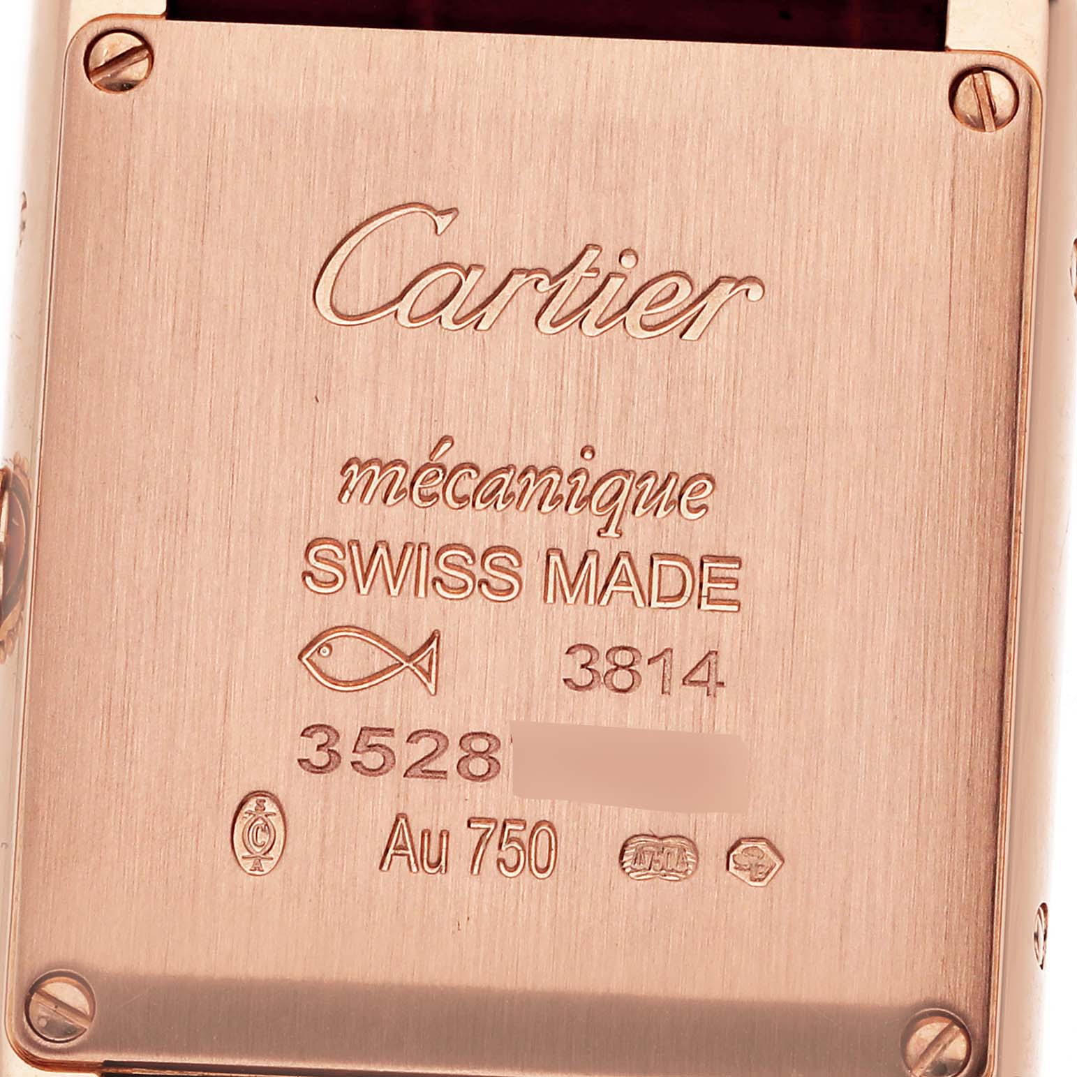 The image shows the back of the Tank Louis watch by Cartier, displaying the engravings and maker's marks.