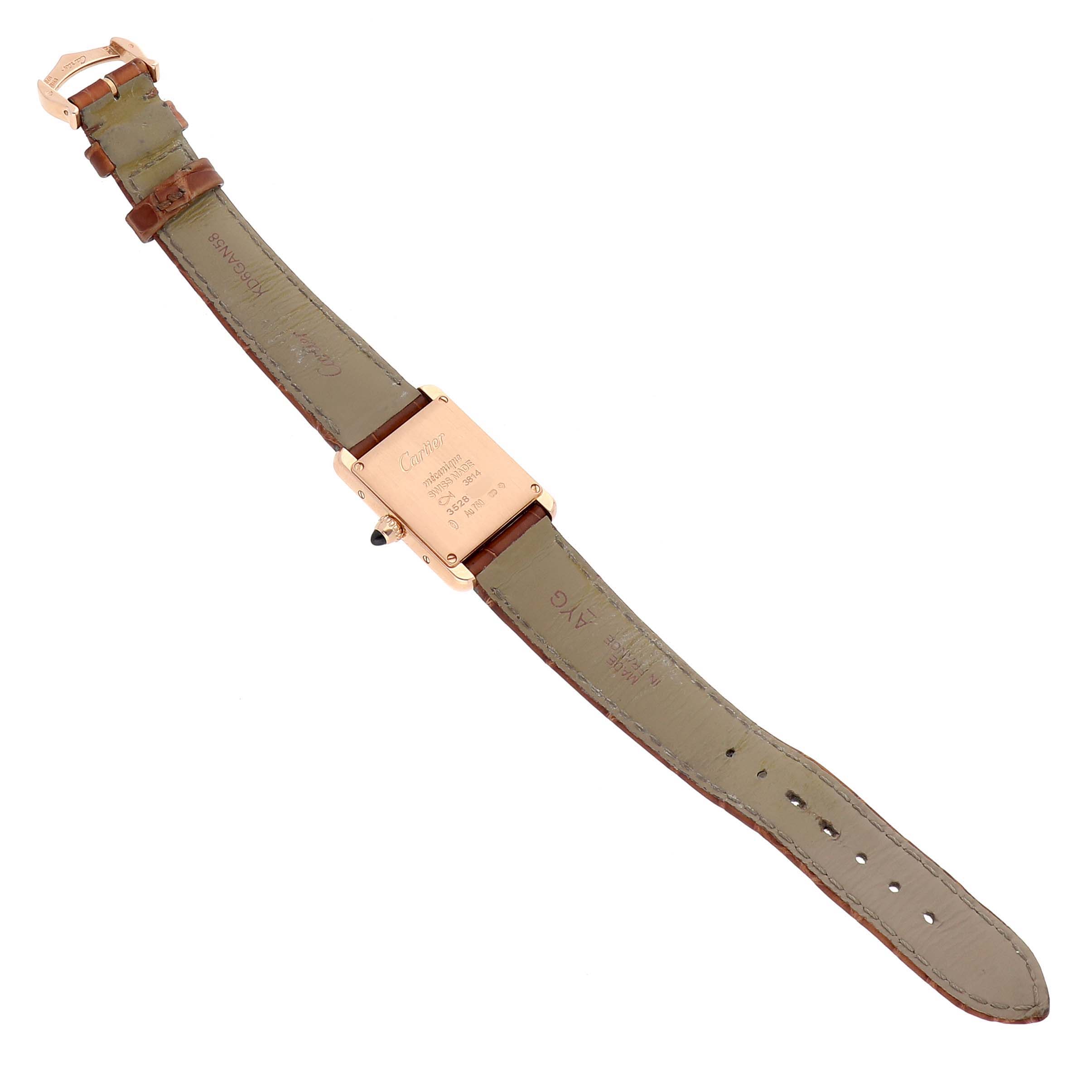 The image shows the back of the Cartier Tank Louis WGTA0010 Women's Yellow Gold Silver Dial WGTA0010 Women's Yellow Gold Silver Dial watch and its leather strap from a top-down angle.