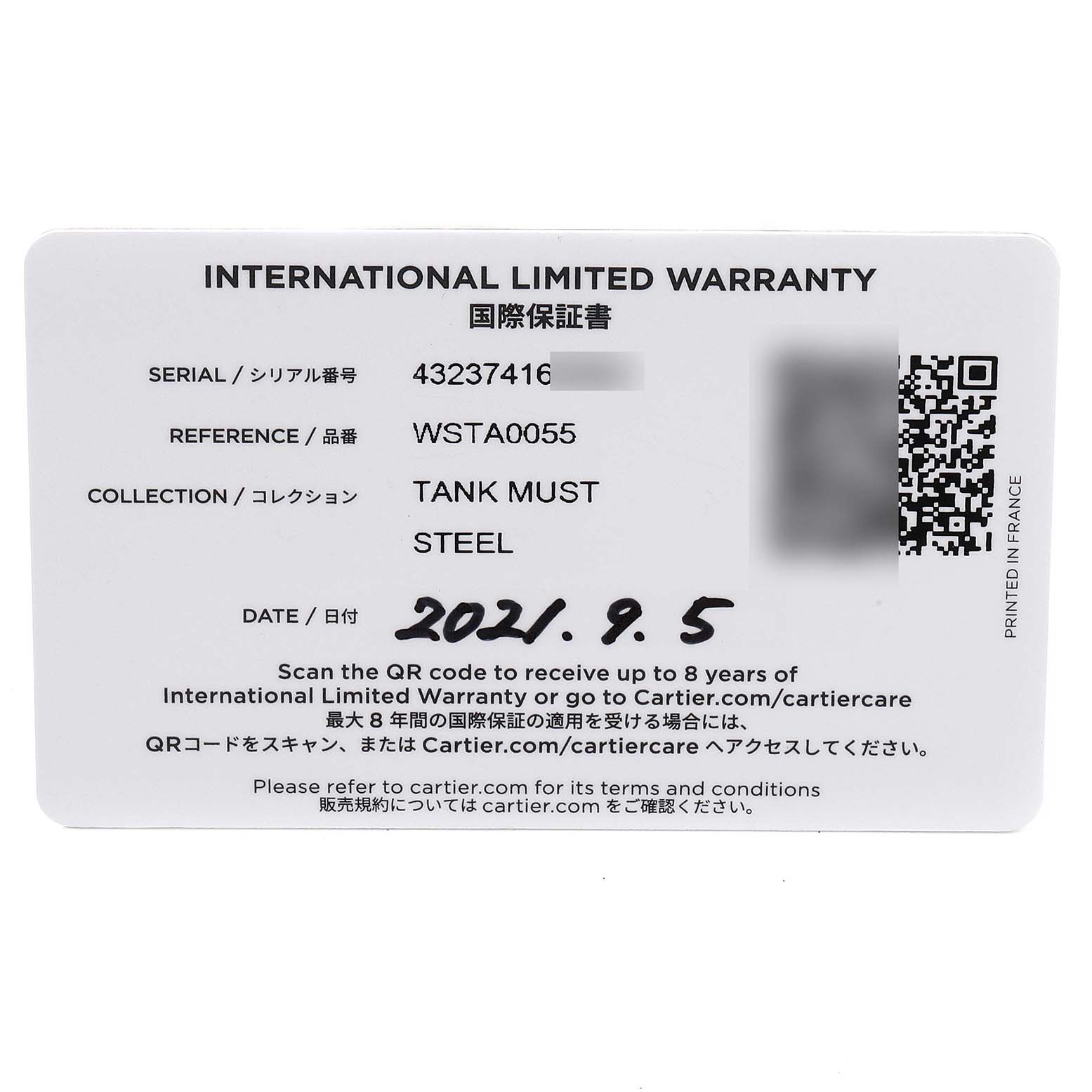 The image shows an international limited warranty card for the Tank Must model by Cartier, detailing serial and reference numbers.