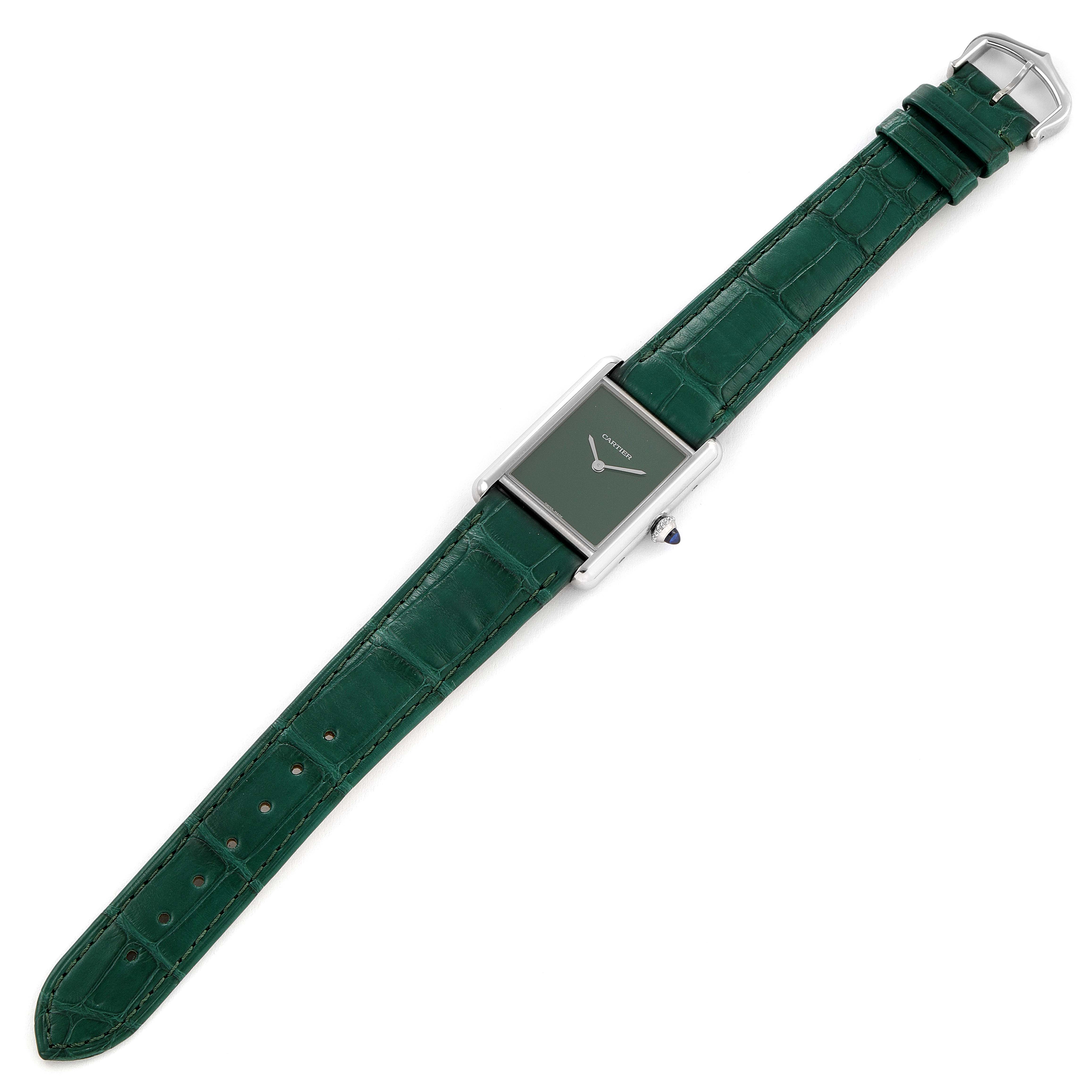 The image shows a top-down view of a Cartier Tank Must WSTA0056 Women's Stainless Steel Green Dial WSTA0056 Women's Stainless Steel Green Dial watch with a green alligator leather strap.