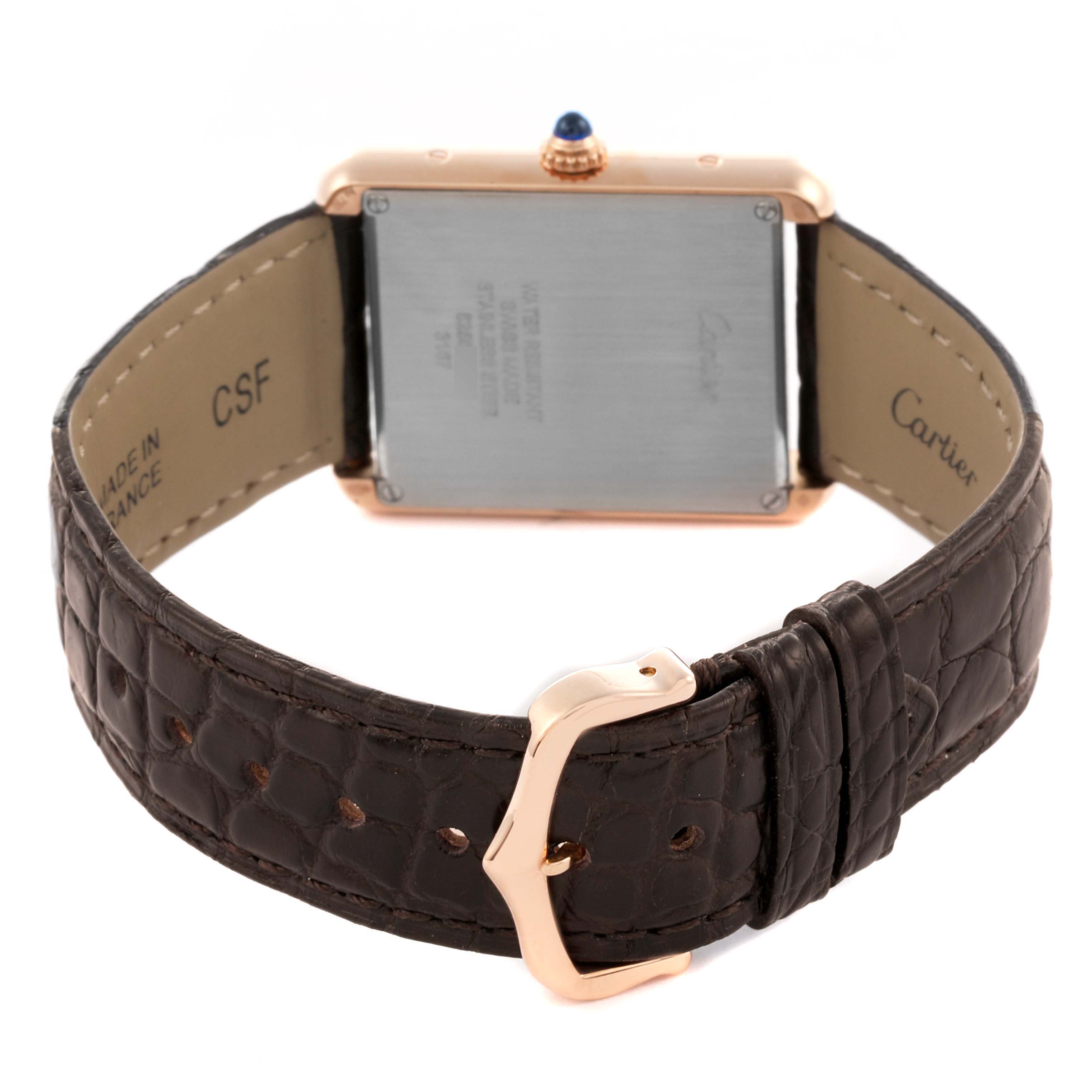 The Cartier Tank Solo W5200025 Men's Steel and Gold (two tone) Silver Dial W5200025 Men's Steel and Gold (two tone) Silver Dial watch is shown from the back, highlighting the case back, strap, and buckle.