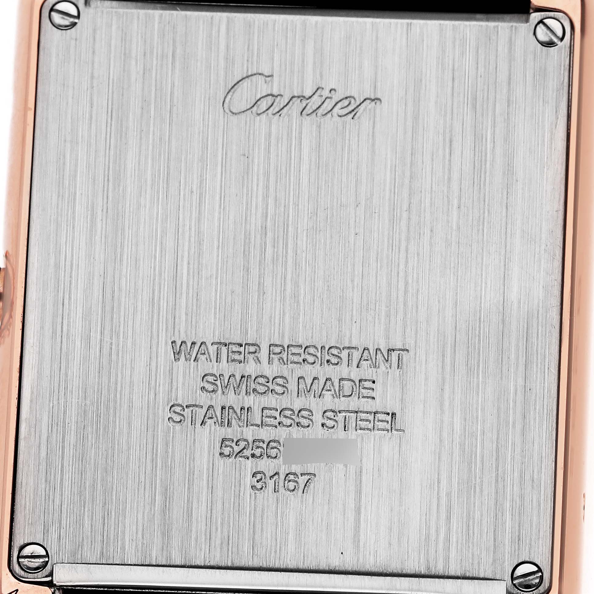 The image shows the back side of a Cartier Tank Solo W5200025 Men's Steel and Gold (two tone) Silver Dial W5200025 Men's Steel and Gold (two tone) Silver Dial watch featuring engravings about water resistance and other details.