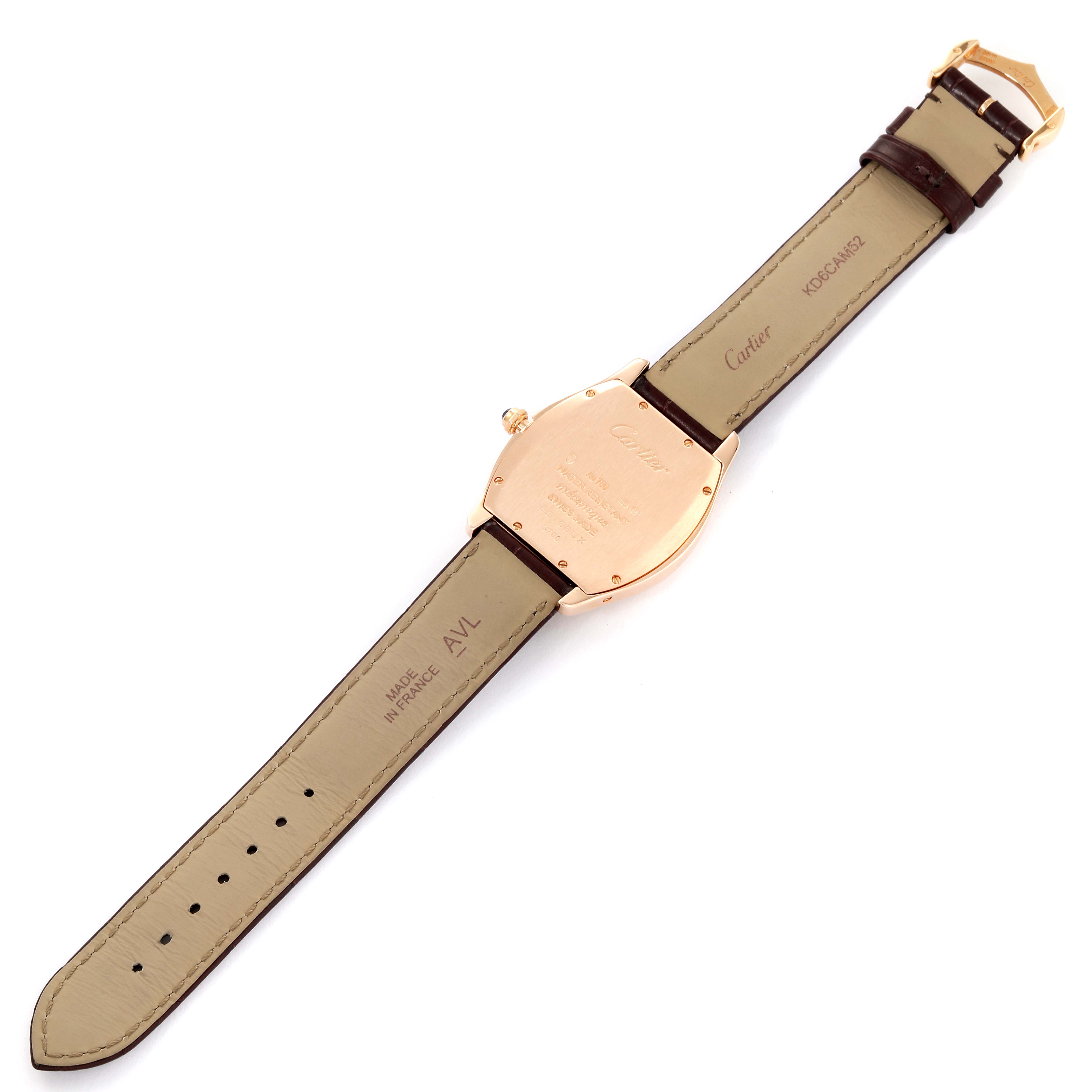 This image shows the back case and strap of the Tortue model by Cartier laid flat, highlighting the engraving and buckle.