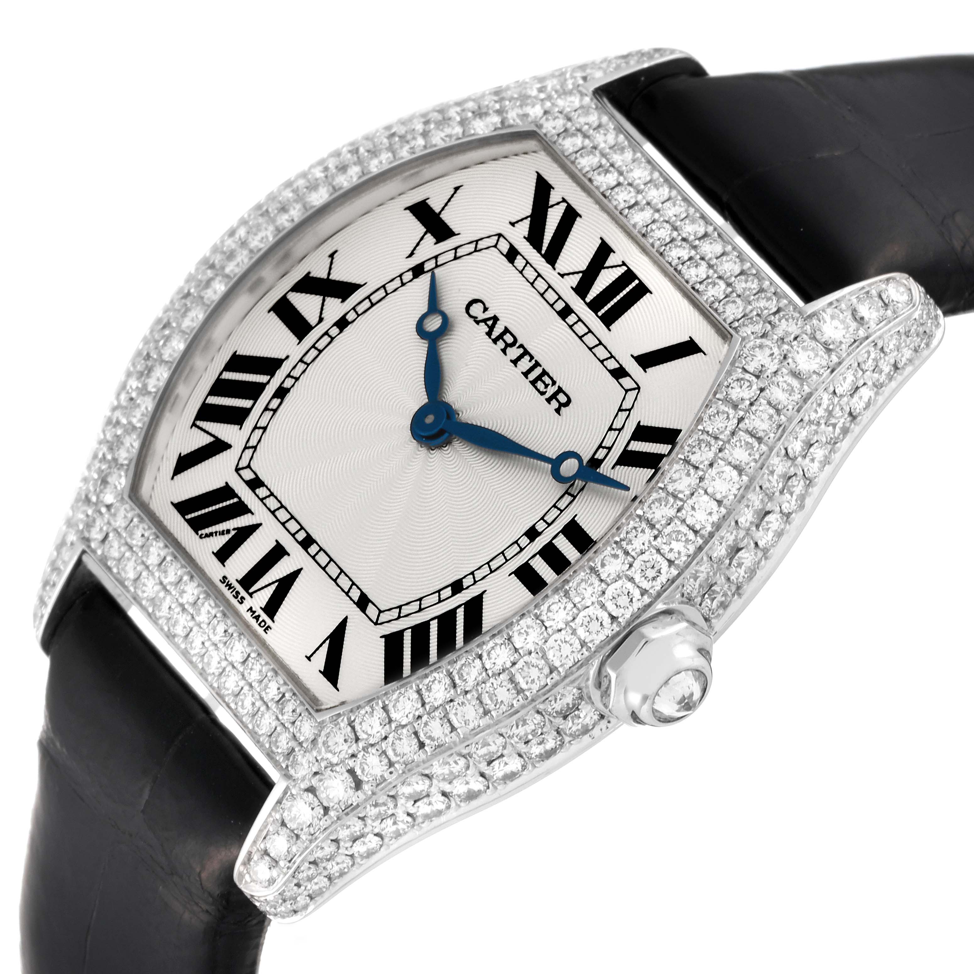 This image shows a close-up of the Cartier Tortue WA504351 Men's White Gold Silver Dial WA504351 Men's White Gold Silver Dial watch face and part of the black strap, highlighting the Roman numerals and diamond-studded casing.