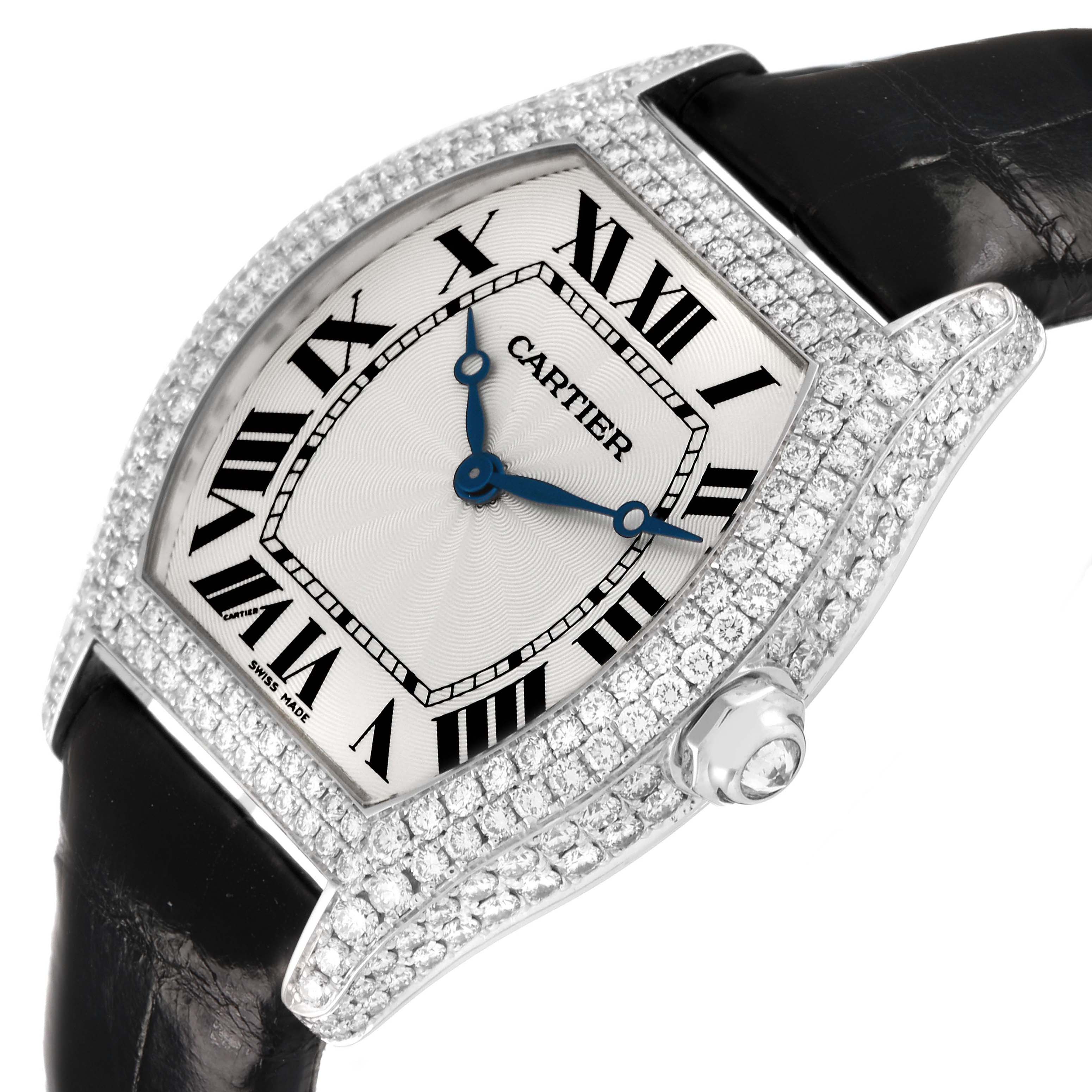 The Cartier Tortue WA504351 Men's White Gold Silver Dial watch is shown at a slight angle, highlighting its diamond-encrusted bezel, Roman numerals, and leather strap.