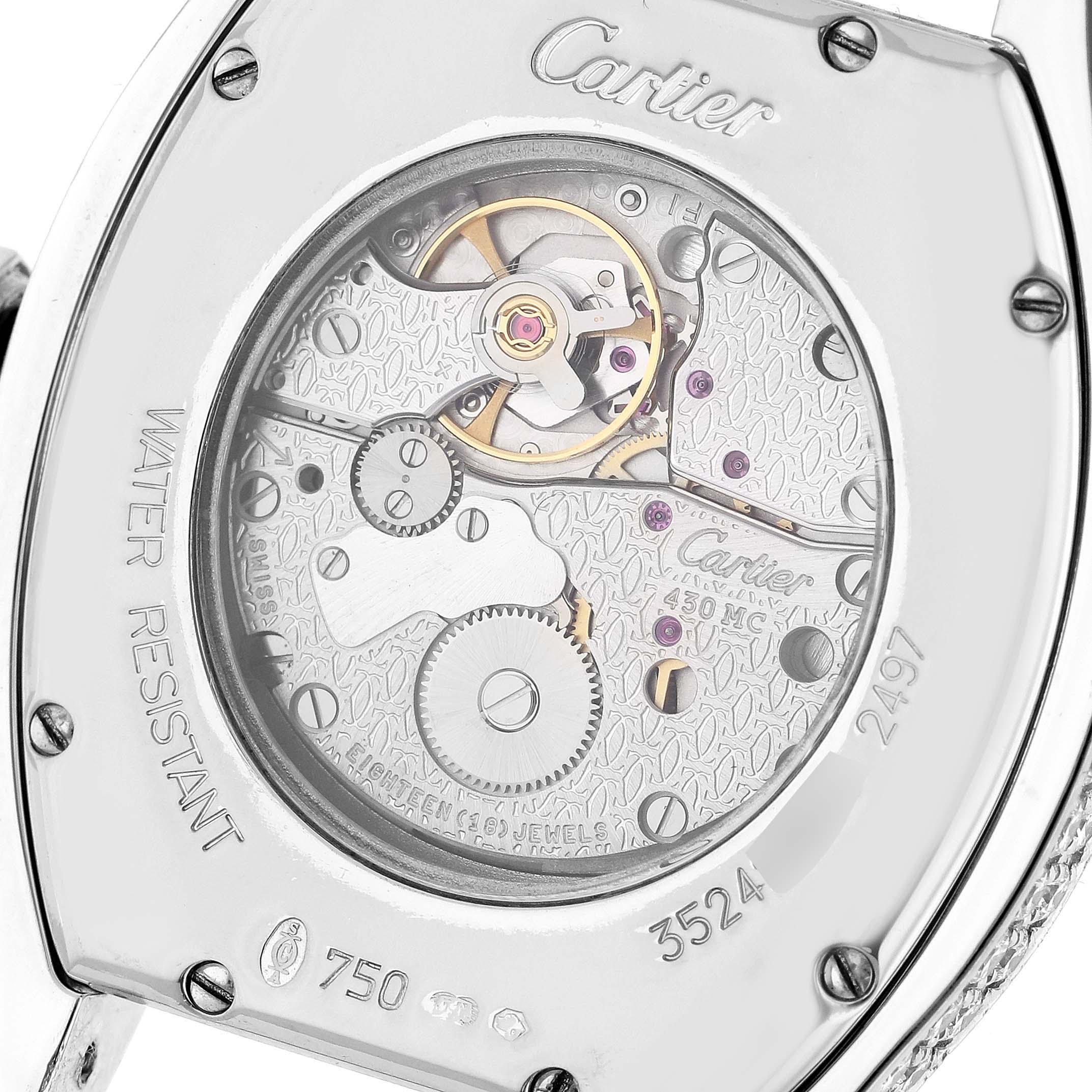This image shows the movement through the transparent case back of a Cartier Tortue WA504351 Men's White Gold Silver Dial WA504351 Men's White Gold Silver Dial watch at a close-up angle.