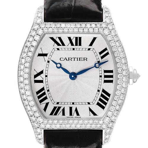 The Cartier Tortue WA504351 Men's White Gold Silver Dial watch displays a top view, showing the diamond-studded bezel, Roman numerals, and blue hands.