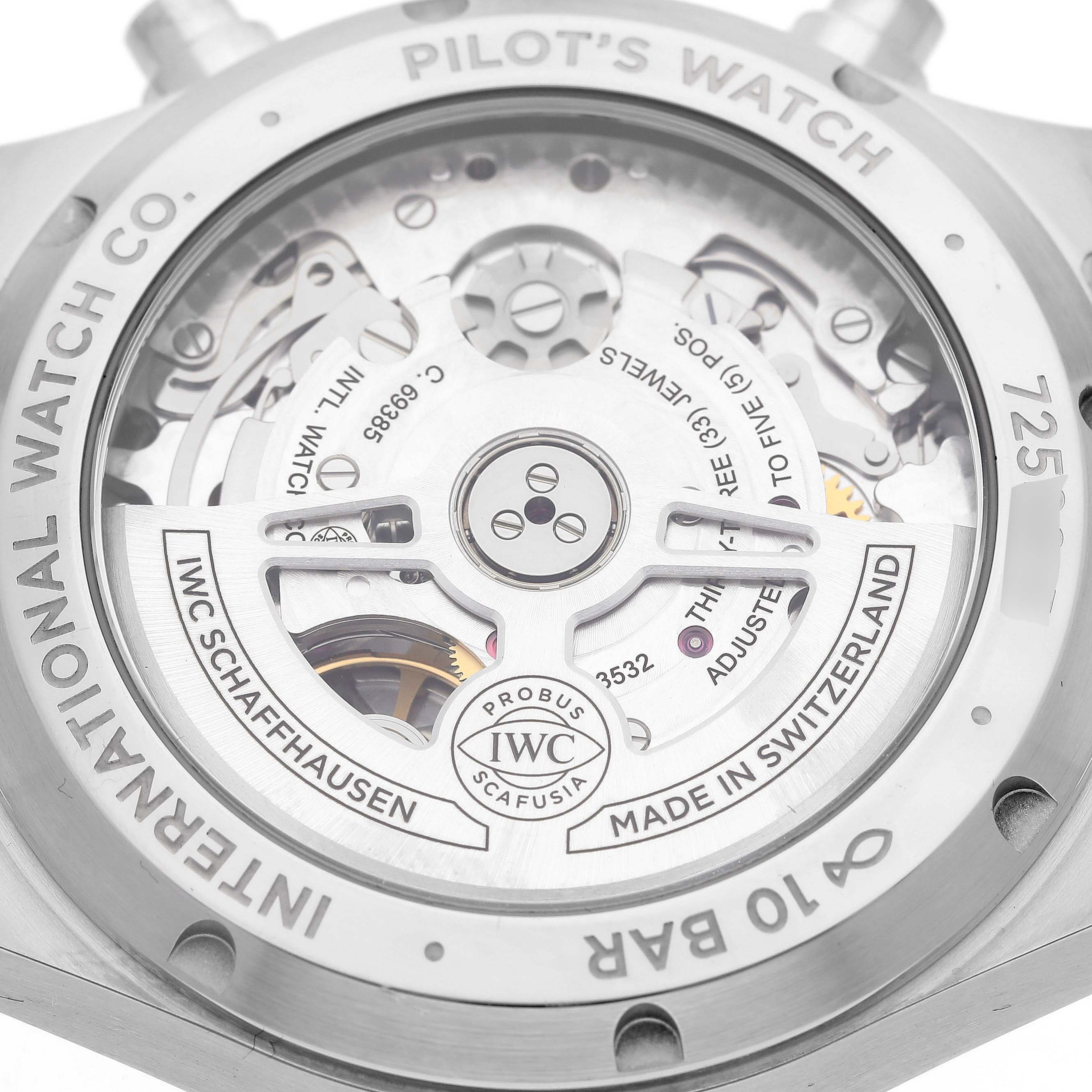 The image shows the back of the IWC Pilot IW388104 Men's Stainless Steel Green Dial IW388104 Men's Stainless Steel Green Dial model watch, revealing its intricate internal movement and engravings.