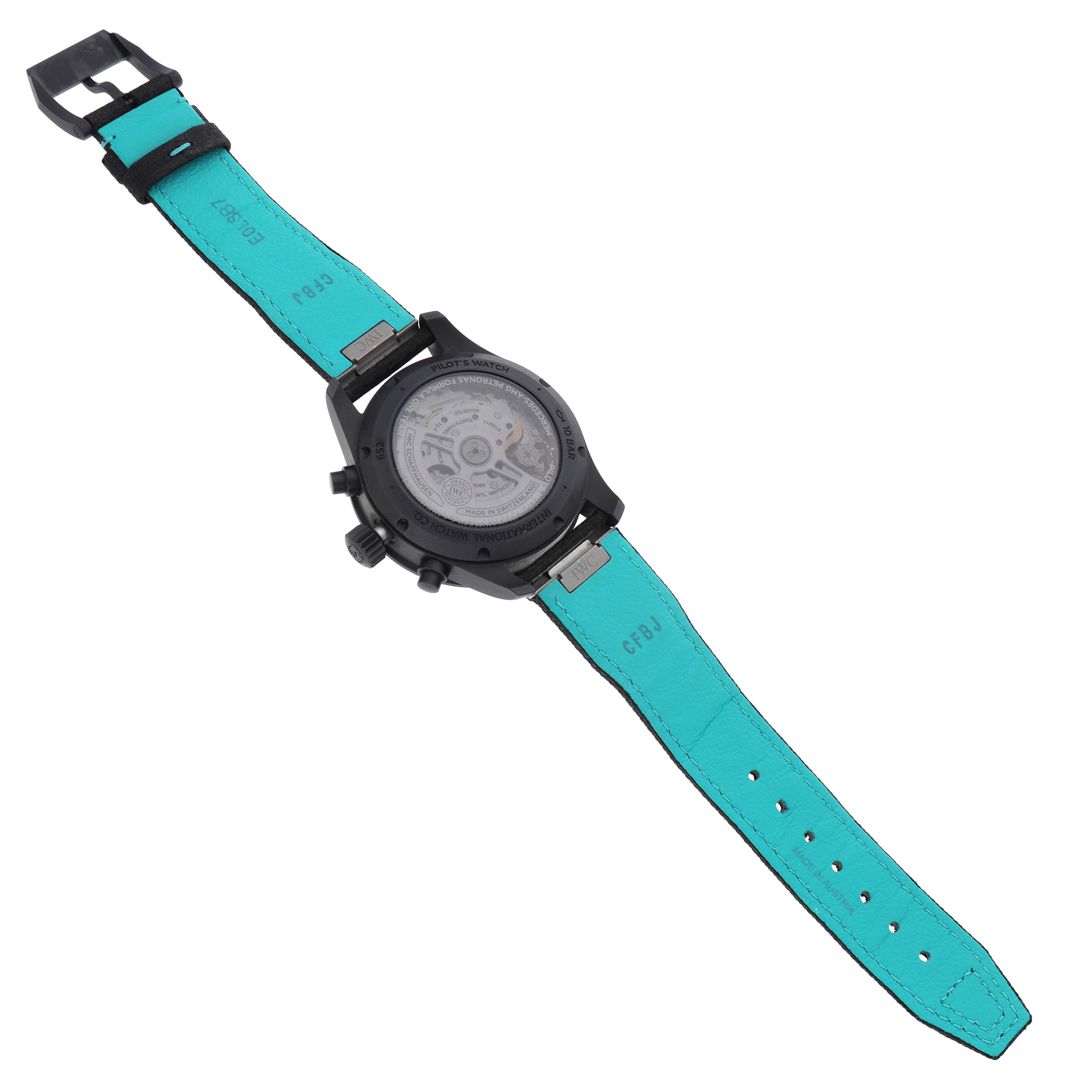 The image shows the back case and strap of an IWC Pilot IW388306 Men's Ceramic Black Dial model, revealing its inner mechanics and turquoise strap interior.