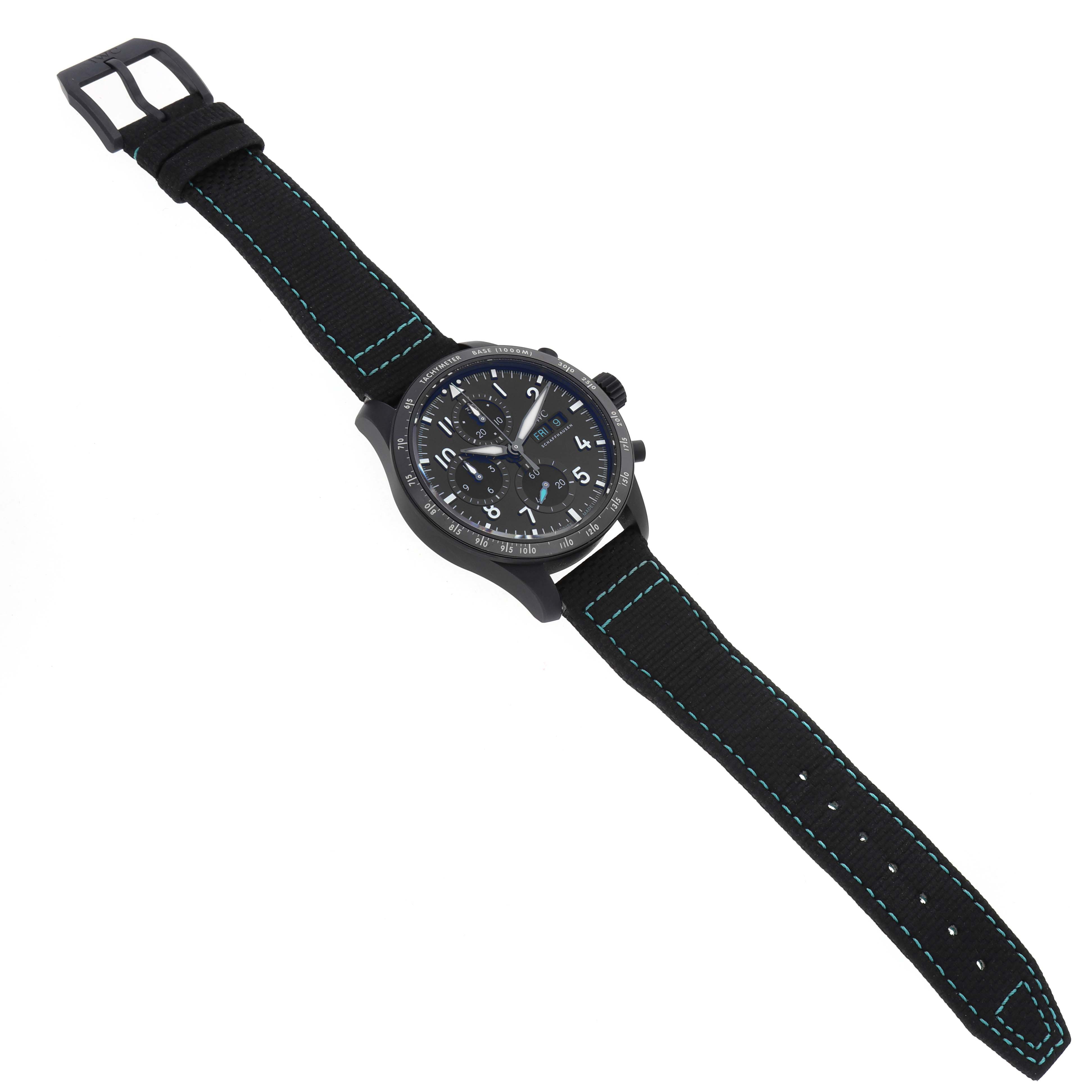 The IWC Pilot IW388306 Men's Ceramic Black Dial watch is shown at an oblique angle, displaying the face, bezel, crown, and strap with blue stitching.