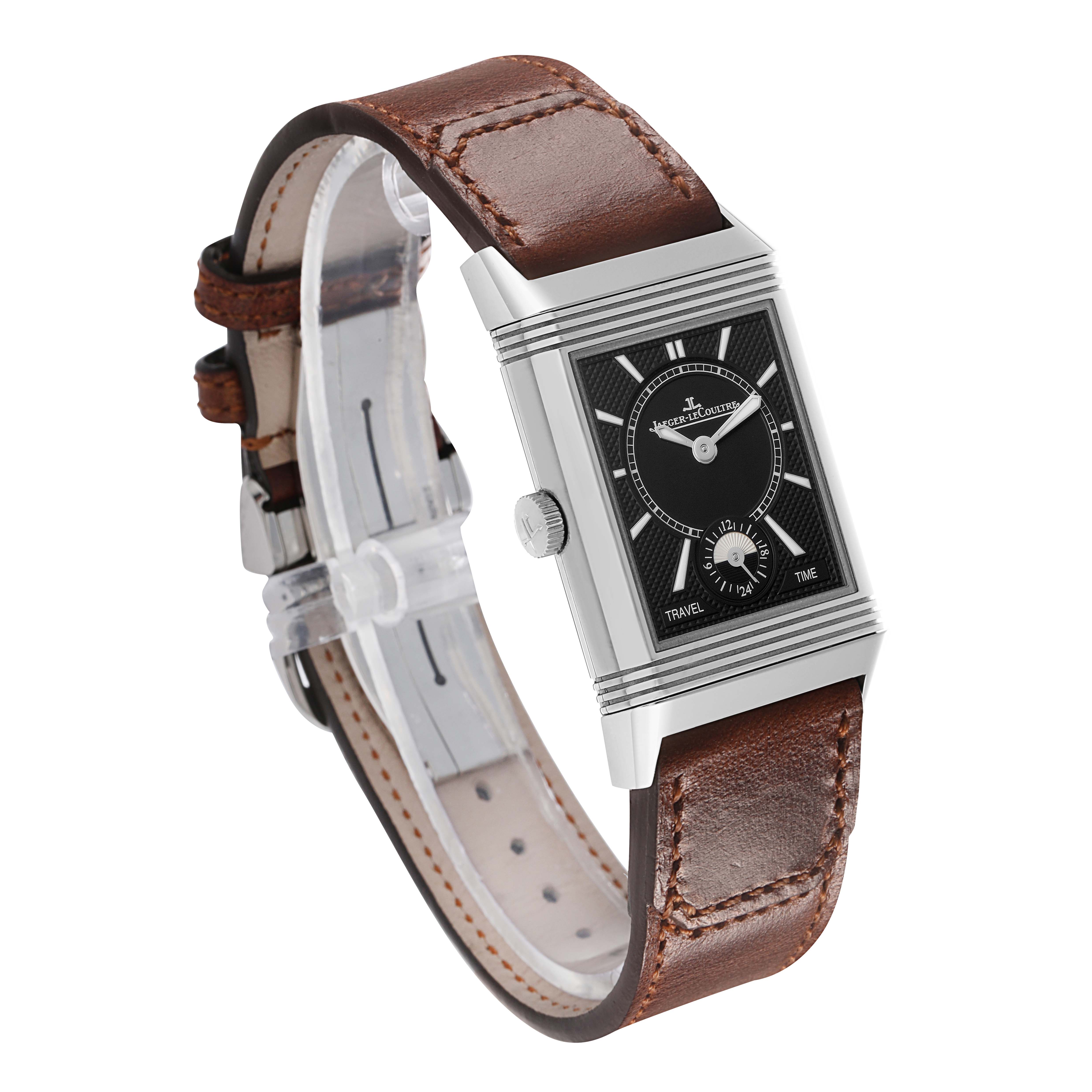 The Jaeger-LeCoultre Reverso watch is shown at a three-quarter angle, highlighting the black dial and brown leather strap.