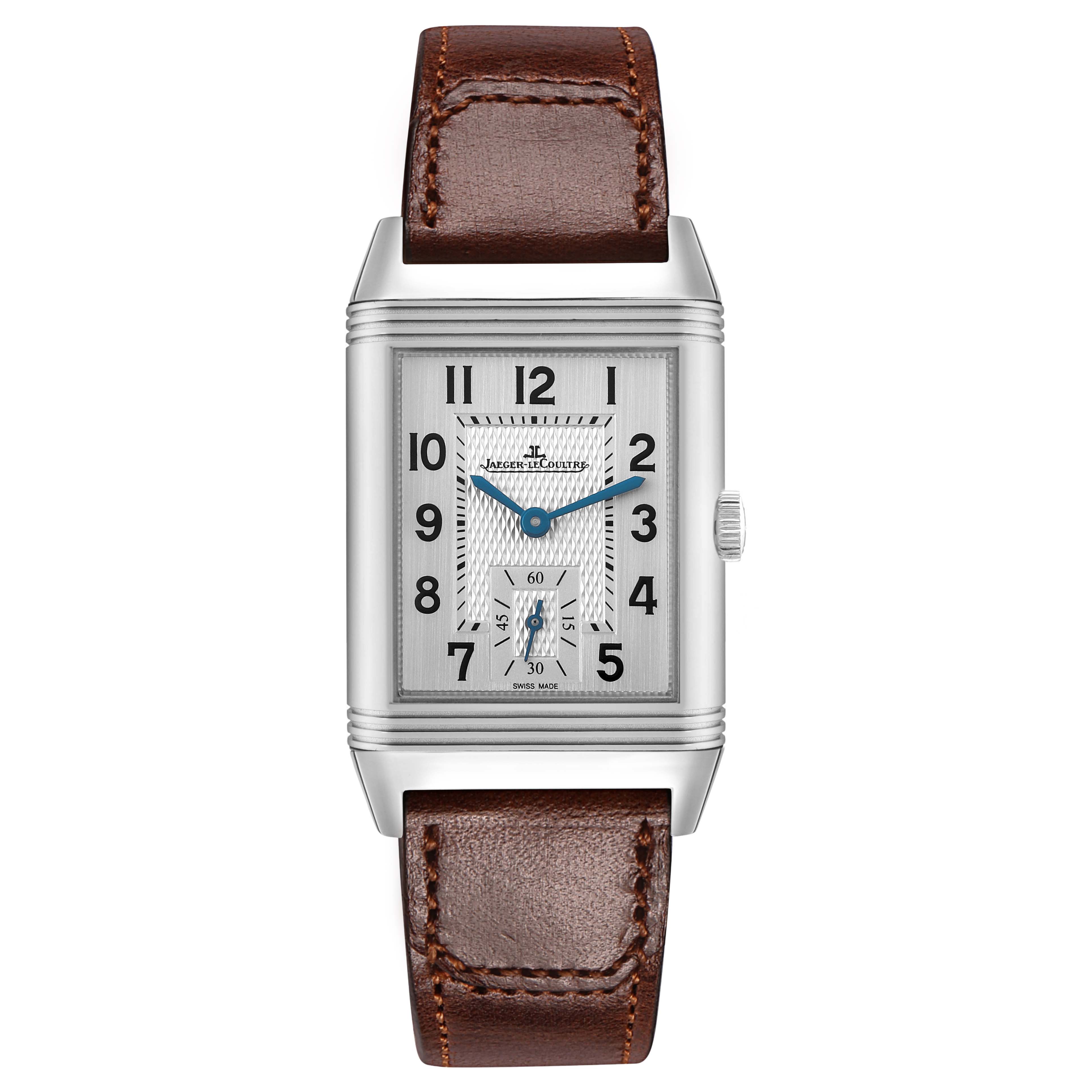 The Jaeger LeCoultre Reverso Q2458422 Men's Stainless Steel Silver Dial watch is shown from the front, displaying its rectangular dial, hands, numerals, and brown leather strap.
