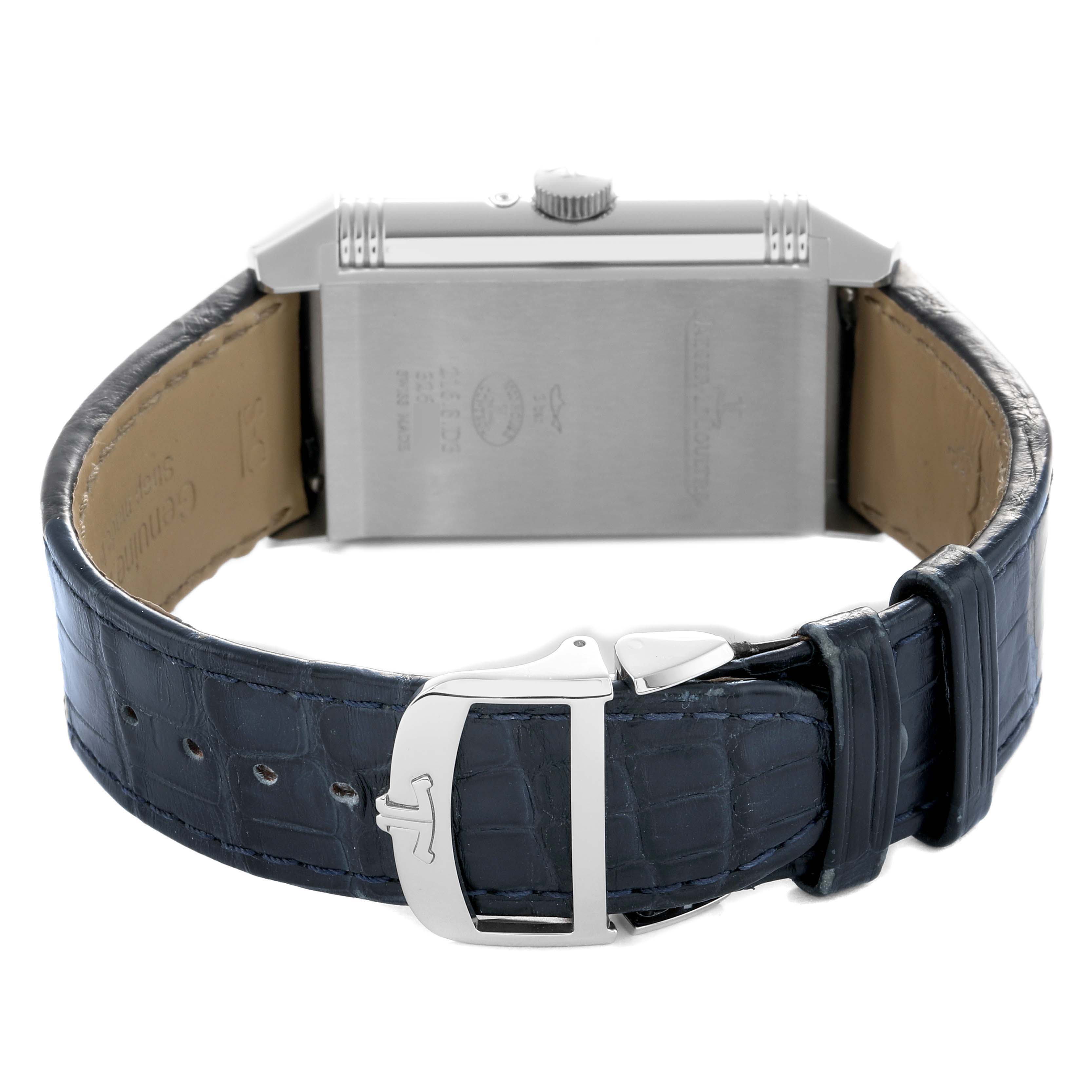 The image shows a Jaeger-LeCoultre Reverso watch from the back, highlighting the clasp and band.
