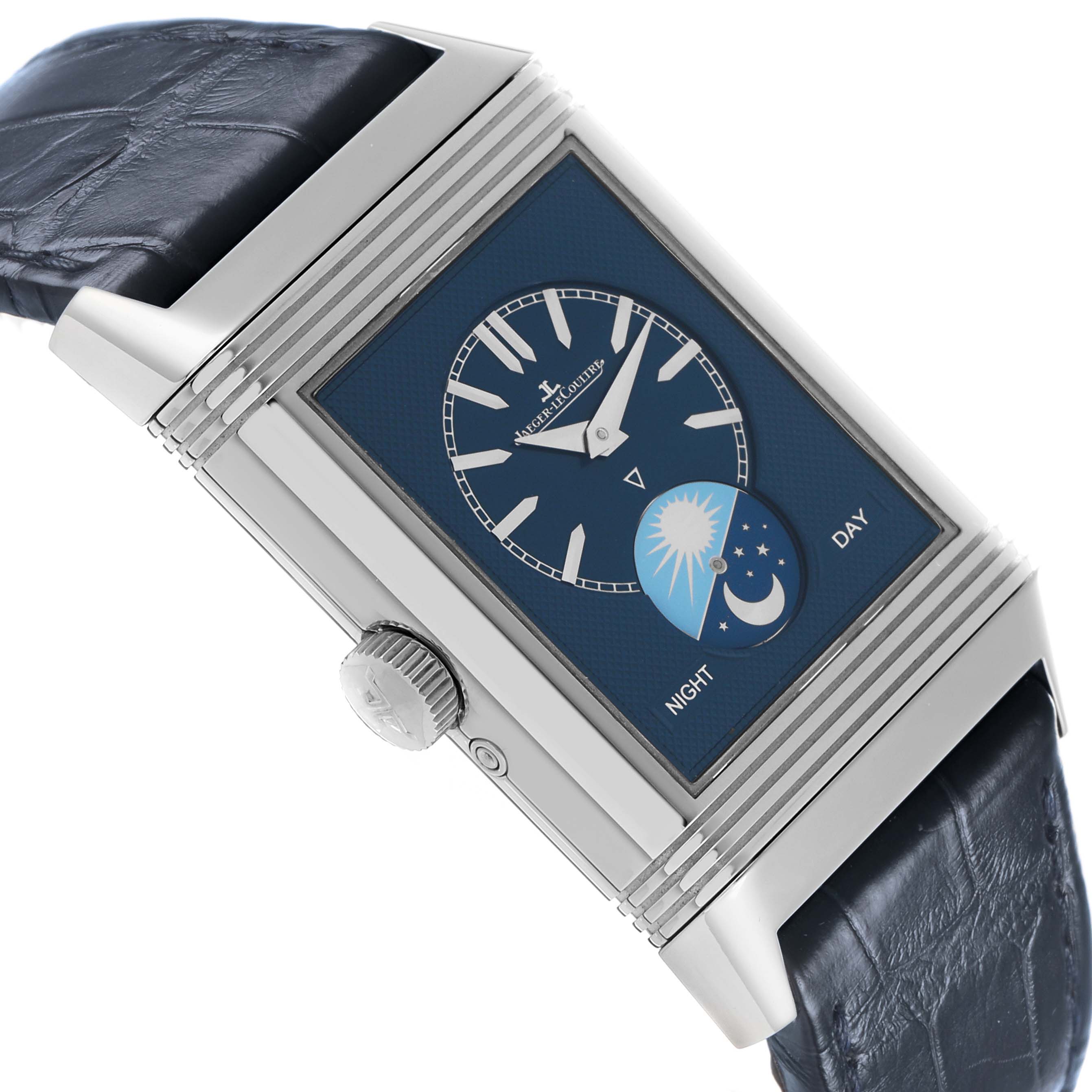 The Jaeger LeCoultre Reverso Q3958420 Men's Stainless Steel Silver Dial watch is shown at an angled side view, highlighting its blue face with day/night indicator and the crown.