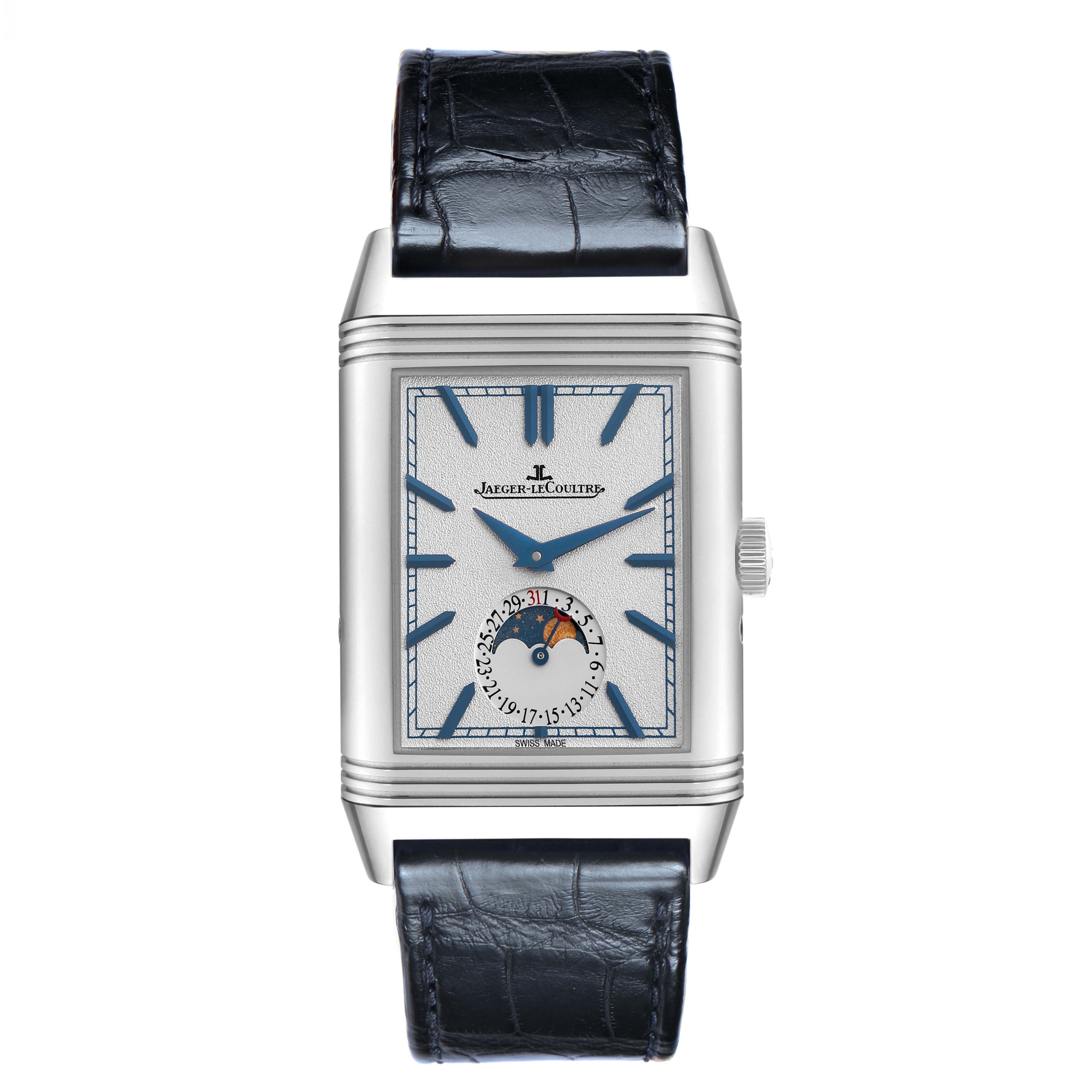 The Jaeger-LeCoultre Reverso watch is shown from the front, highlighting its rectangular face, moon phase dial, and leather strap.