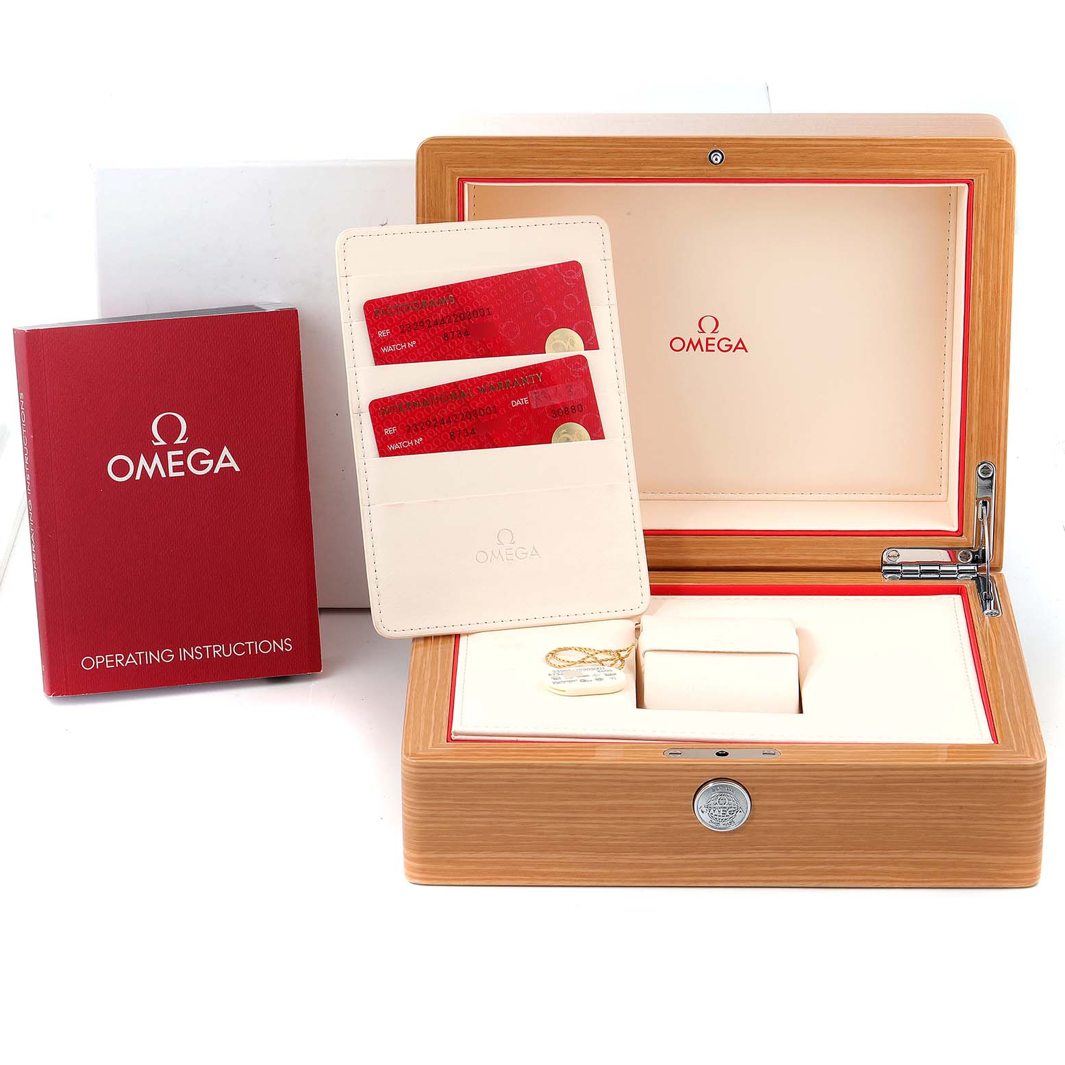 The image shows the Omega Planet Ocean 232.92.44.22.03.001 Men's Titanium Blue Dial 232.92.44.22.03.001 Men's Titanium Blue Dial watch accessories, including a wooden box, operating instructions, and warranty cards.