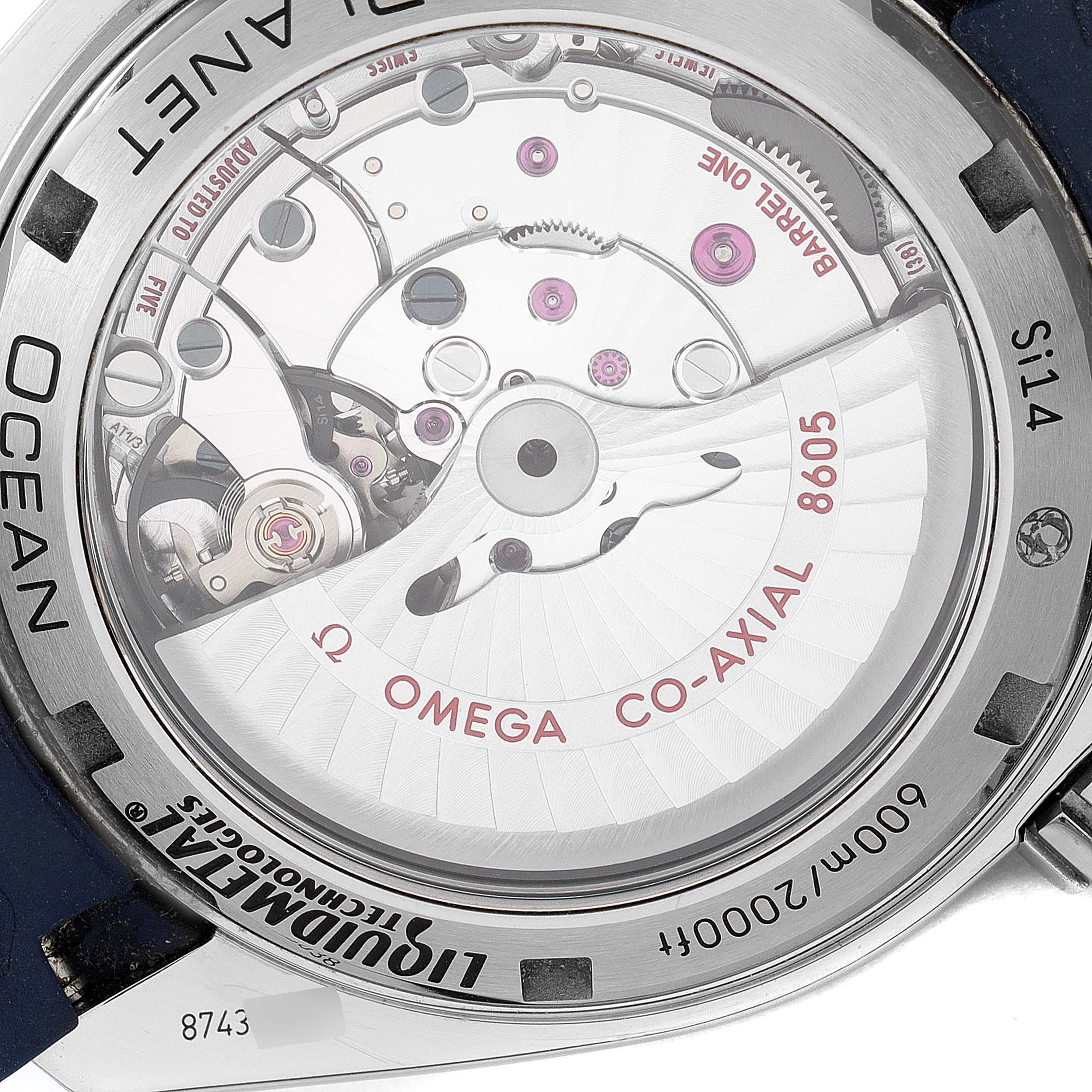 The image shows the back of the Omega Planet Ocean 232.92.44.22.03.001 Men's Titanium Blue Dial 232.92.44.22.03.001 Men's Titanium Blue Dial watch, highlighting its Co-Axial movement and inner mechanical components.