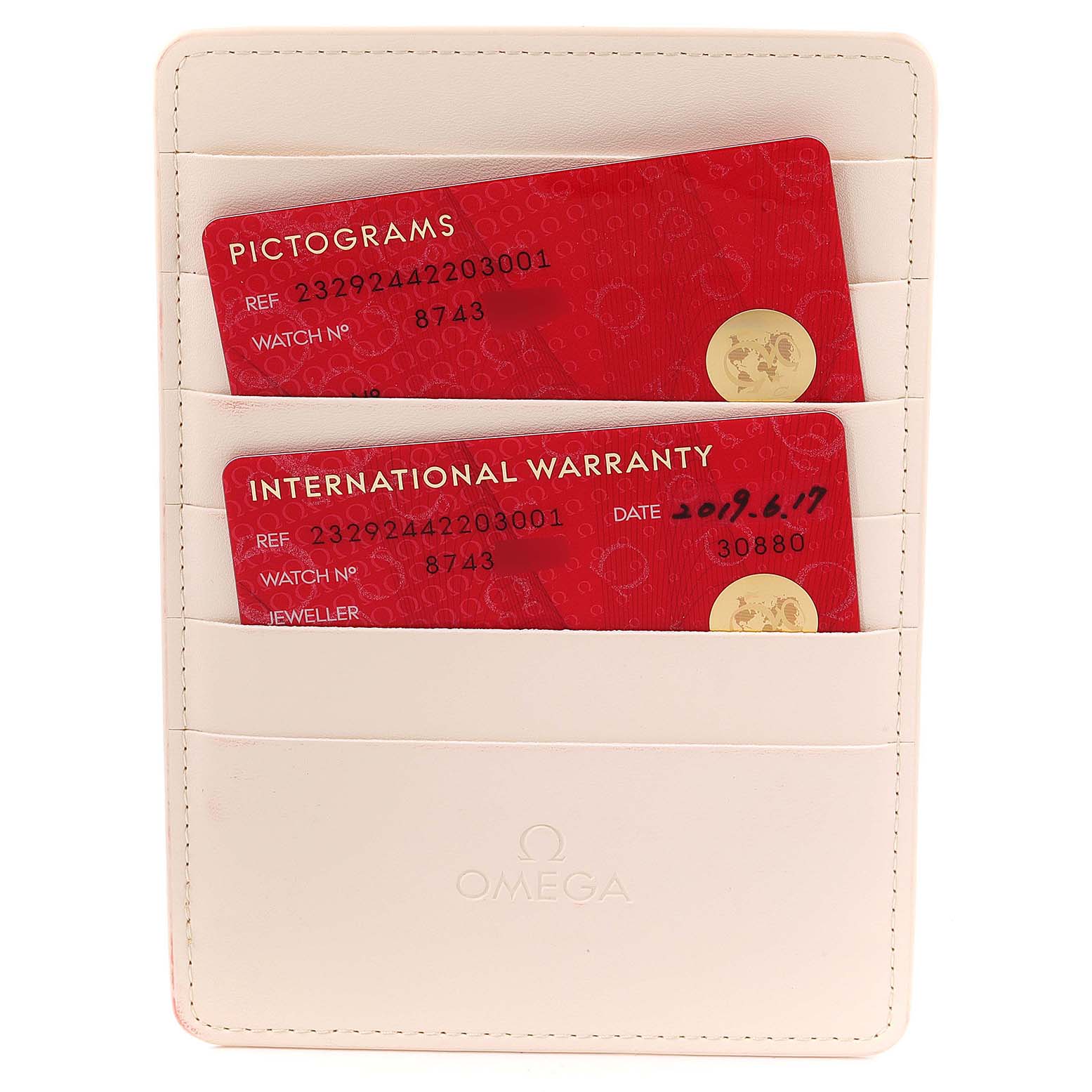 The image shows the warranty and pictogram cards for an Omega Planet Ocean 232.92.44.22.03.001 Men's Titanium Blue Dial 232.92.44.22.03.001 Men's Titanium Blue Dial watch in a beige cardholder.