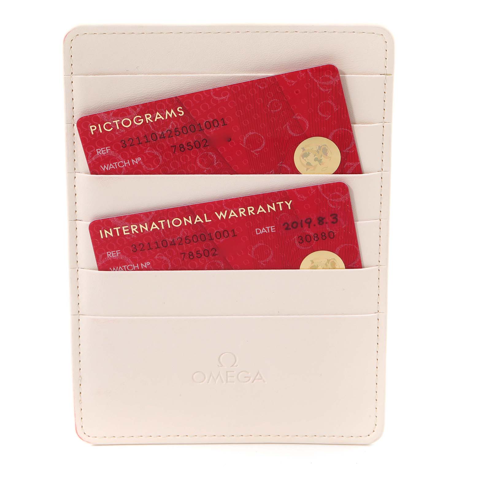 This image shows the warranty cards for the Omega Speedmaster 321.10.42.50.01.001 Men
s Stainless Steel Black Dial 321.10.42.50.01.001 Men
s Stainless Steel Black Dial, placed in a white Omega cardholder.